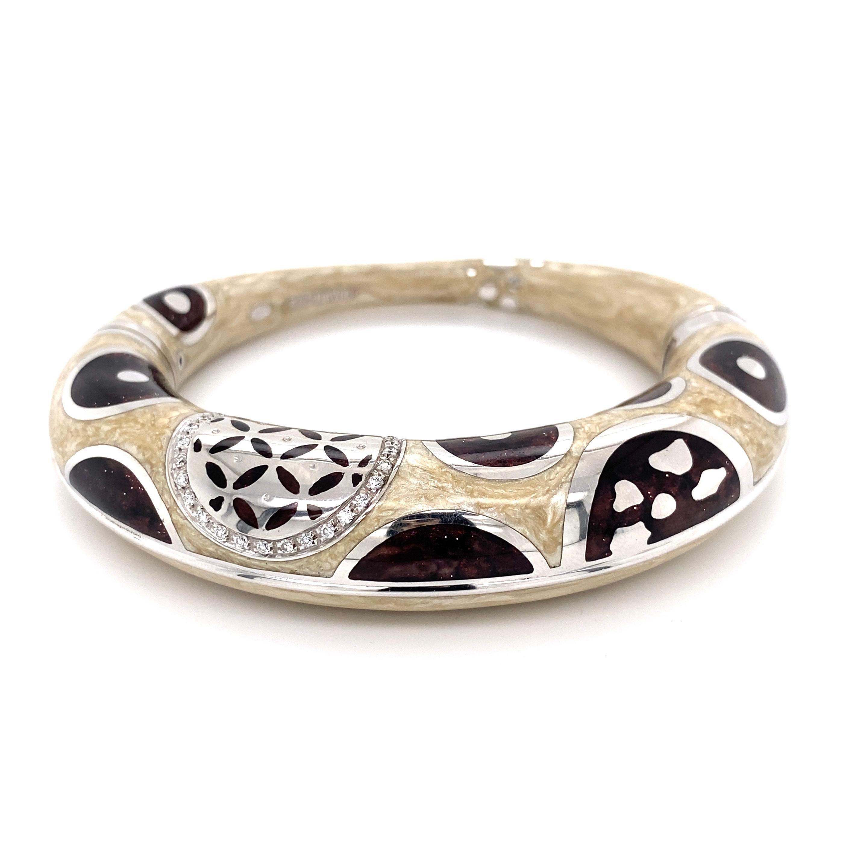 Awesome Enamel and Diamond Gold Bangle Cuff Bracelet. Hand set with round Brilliant Diamonds, weighing approx. 0.30tcw. Beautifully Hand crafted White and Burgundy abstract designs, in 18K White Gold and 925. Measuring approx. 2.85” x 3.35” x 0.67”.