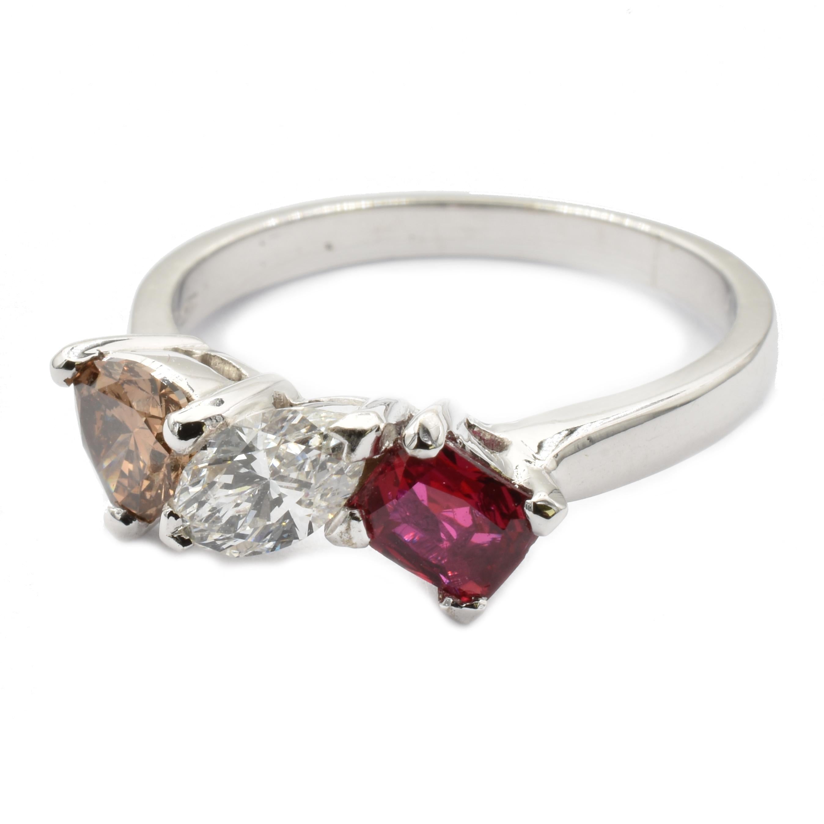 Gilberto Cassola 18Kt White Gold Three Stone Ring with a Marquise White Diamond, a Trillion Cut Dark Champagne Diamond and an Octagonal Cut Deep Red Ruby. 
G Color Vs Clarity Marquise Cut Diamond ct 0.40
Fancy Color Dark Champagne Trillion Diamond