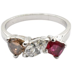 Used White and Champagne Diamonds and Ruby Three-Stone Ring Made in Italy