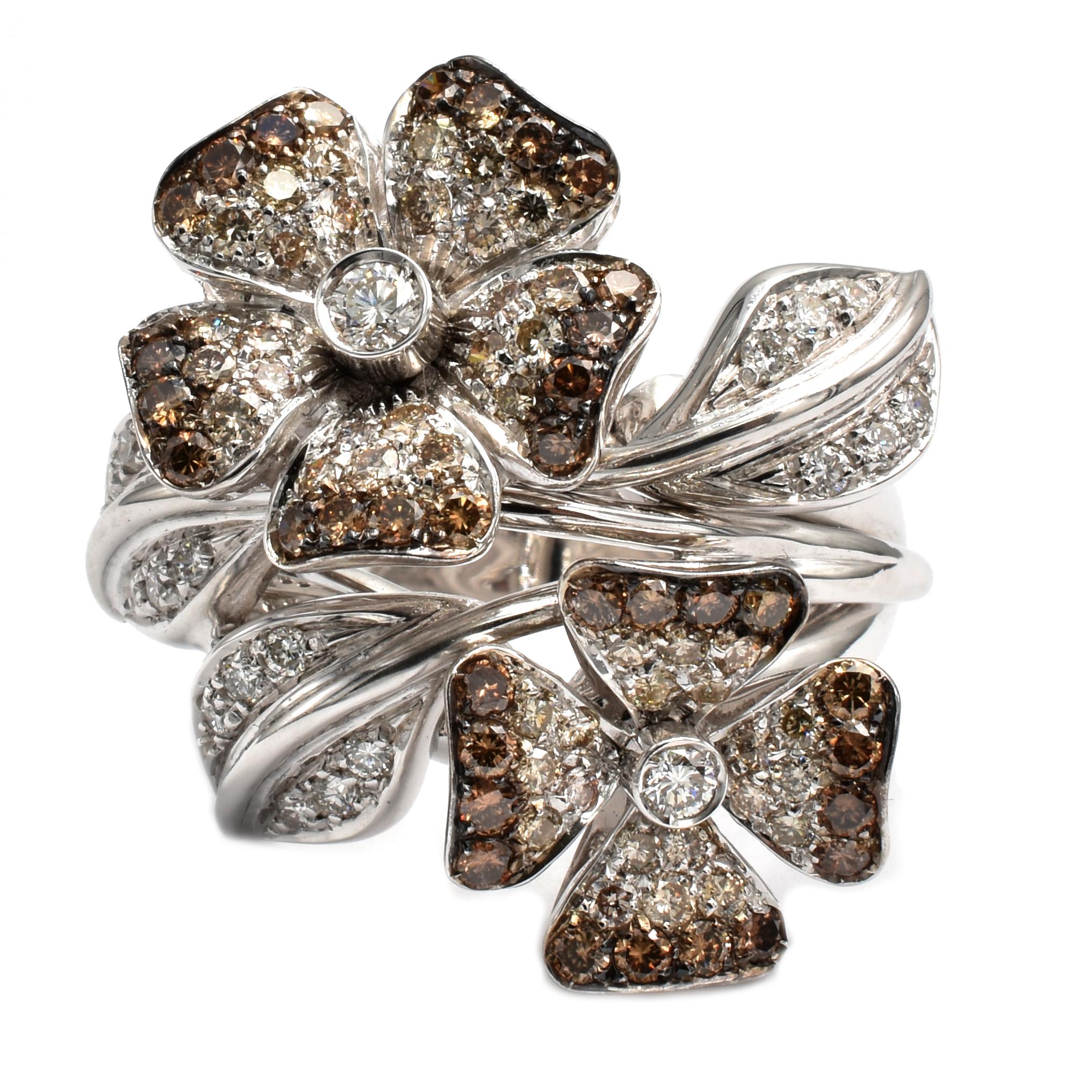 18Kt White Gold Double Flower Ring with White Diamonds that fade into Champagne and Brown Diamonds on the Petals.
The Flowers spin and the Leaves can move a little. 
Handmade in Italy in Our Atelier in Valenza (AL)
18 Kt Gold g 16.40
G Color Vs