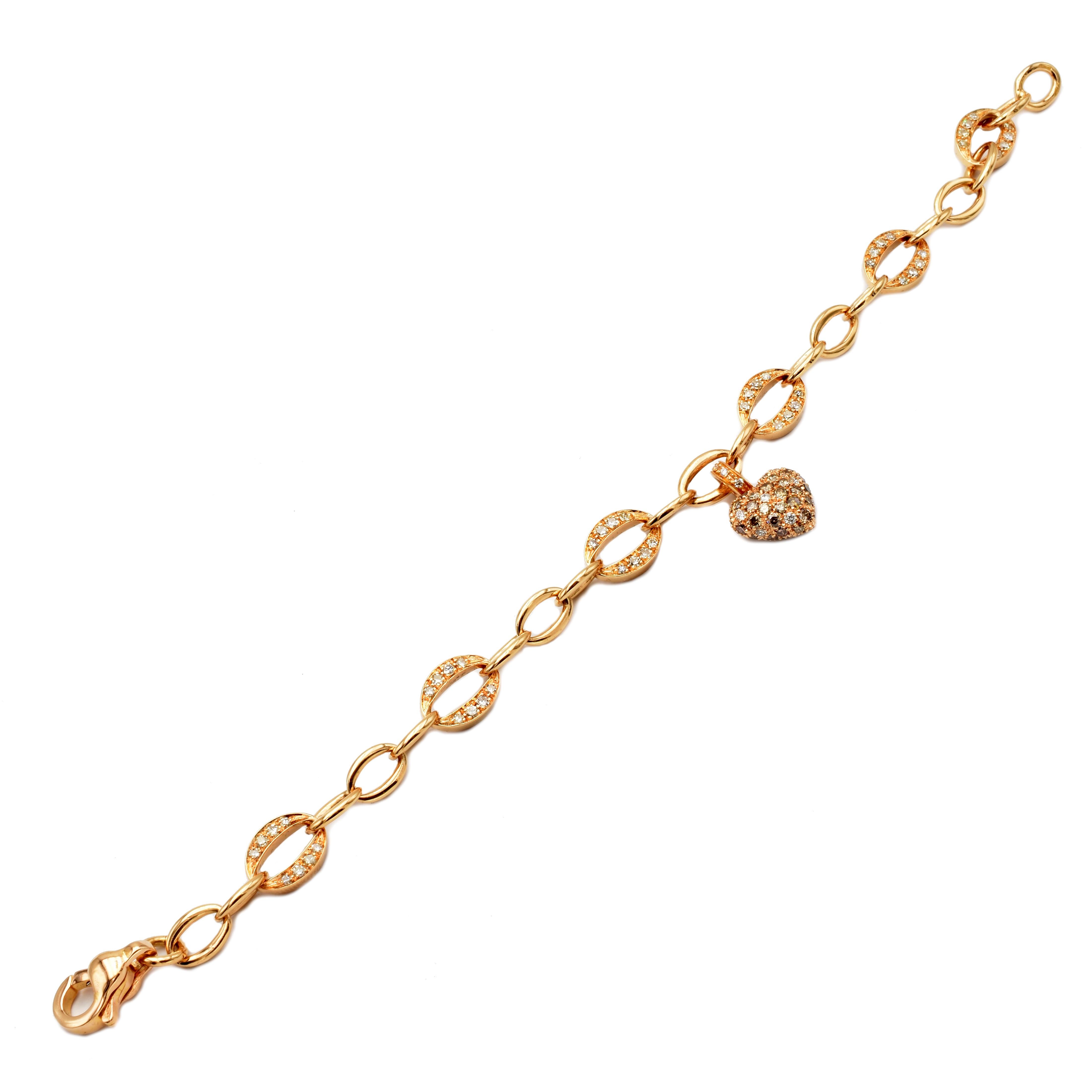 18 Kt Rose Gold Charm Bracelet with a Hanging Heart Completely set in White and Champagne Diamonds. 
Handmade in Italy in our Atelier in Valenza (AL).
18Kt Gold g 15.70
White Diamonds (G Color Vs Clarity) ct 1.06
Champagne Diamonds ct 1.56
The Heart