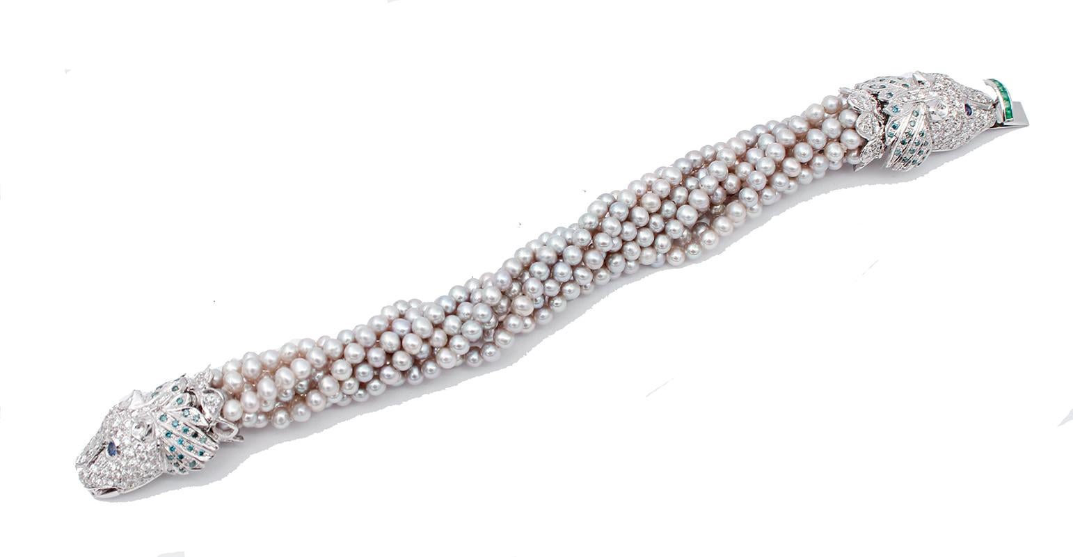 SHIPPING POLICY: 
No additional costs will be added to this order. 
Shipping costs will be totally covered by the seller (customs duties included).

Particular bracelet in 14 karat white gold mounted with  an intertwining of strings of pearls and,