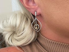 White and Fancy Yellow Dangly Diamond Heart Earrings in 18K White Gold
