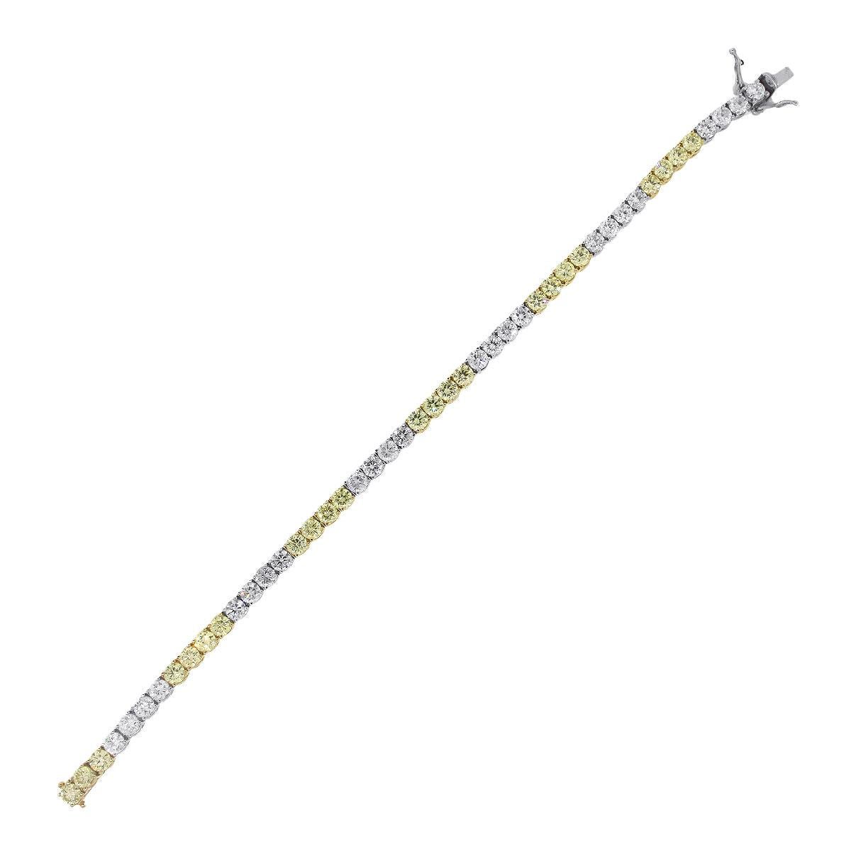 Material: 18k white gold & yellow gold
Diamond Details: Approximately 9.39ctw of round brilliant diamonds. Diamonds are Fancy Yellow, G-H in color and SI-I1 in clarity
Clasp: Tongue in box with safety
Measurements: Will fit a 7″ wrist
Total Weight: