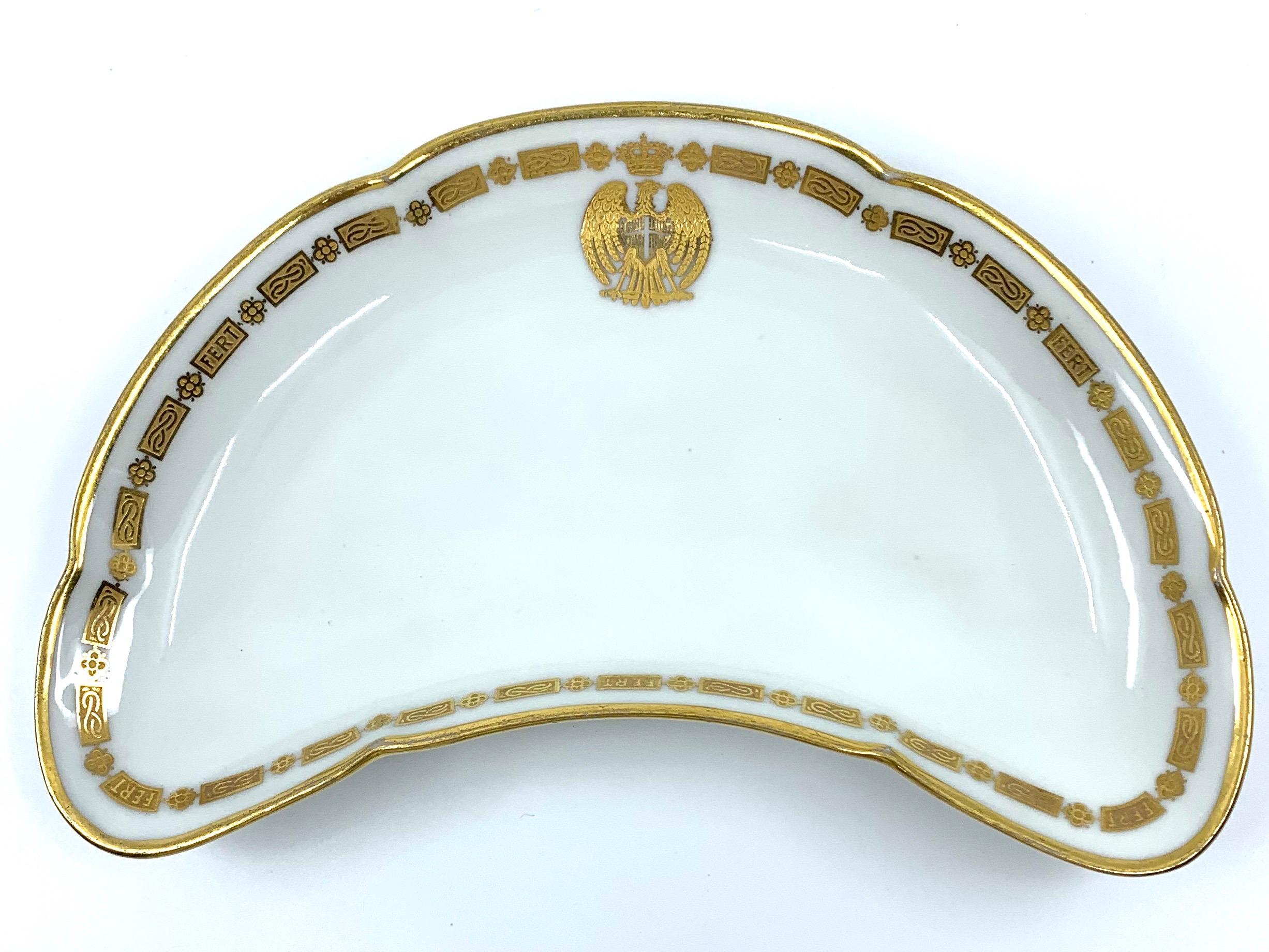Italian military bone dish vide-poche.  Royal House of Savoy gilt white porcelain shaped and lobed bone dish / vide poche with crowned eagle and border; with markings for Richard-Ginori Pittoria di Doccia and stamped for the Foreign Ministry, Rome. 