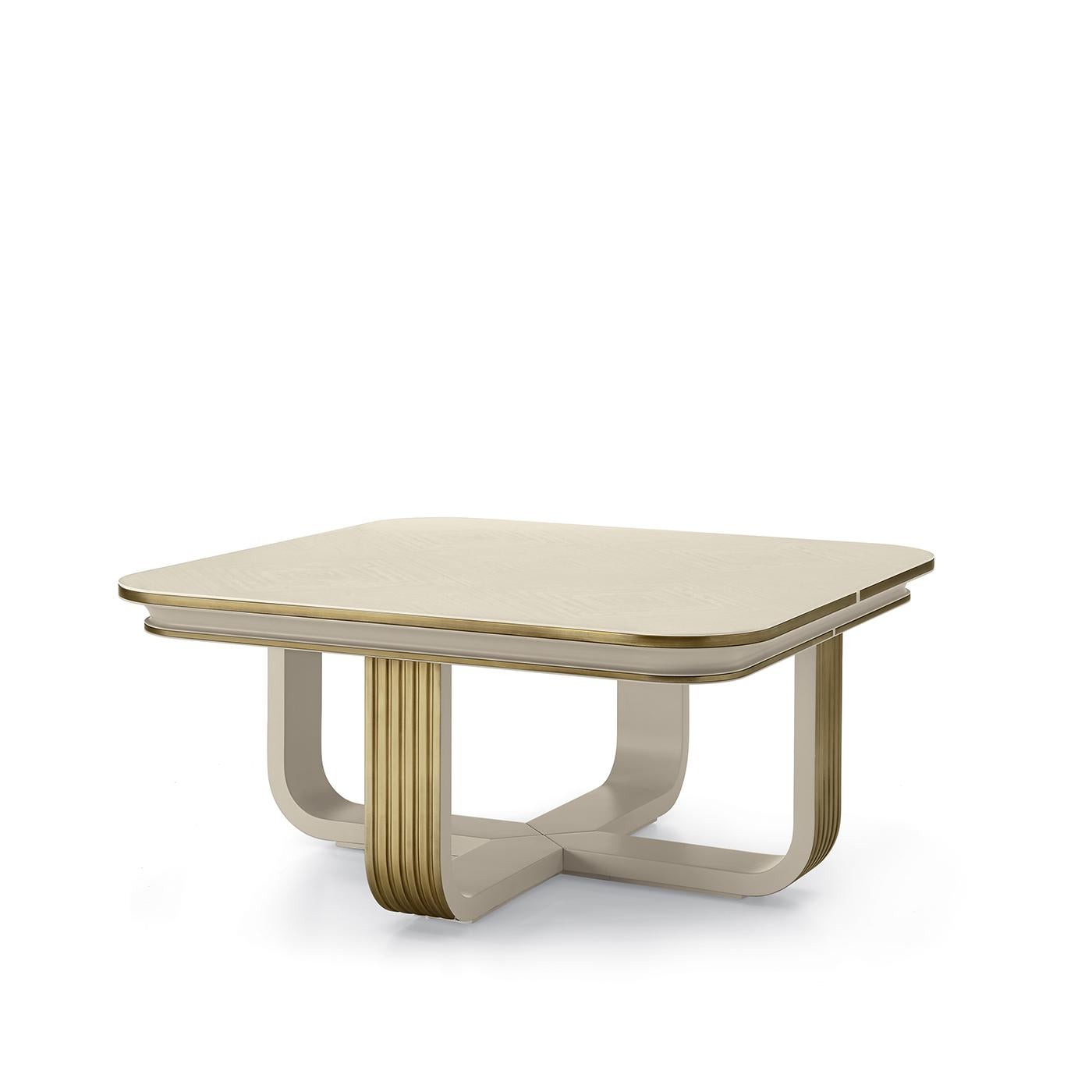 This coffee table exudes refined sophistication in its sinuous and sleek silhouette enhanced by an elegant combination of white and gold. Crafted of white eucalyptus-veneered MDF, the rectangular top is supported by the superbly curved profile of