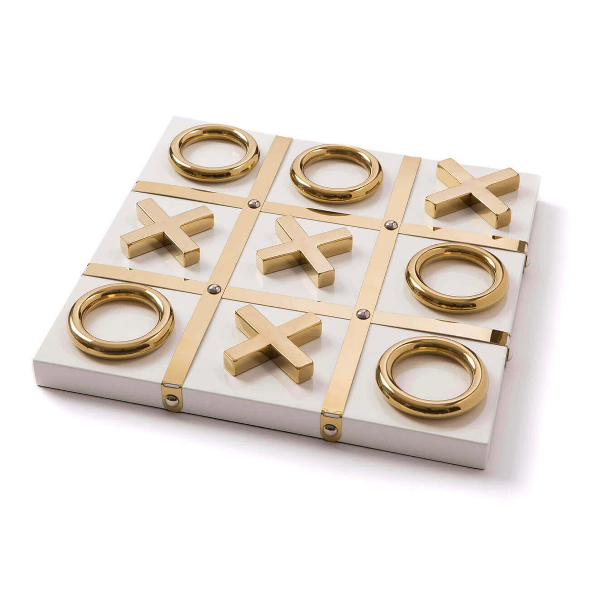 A luxury game night is ready with this white and gold Tic Tac Toe set made out of high quality acrylic with gold accents. Comes with 5 X’s and 5 O’s. 

Dimensions: 2