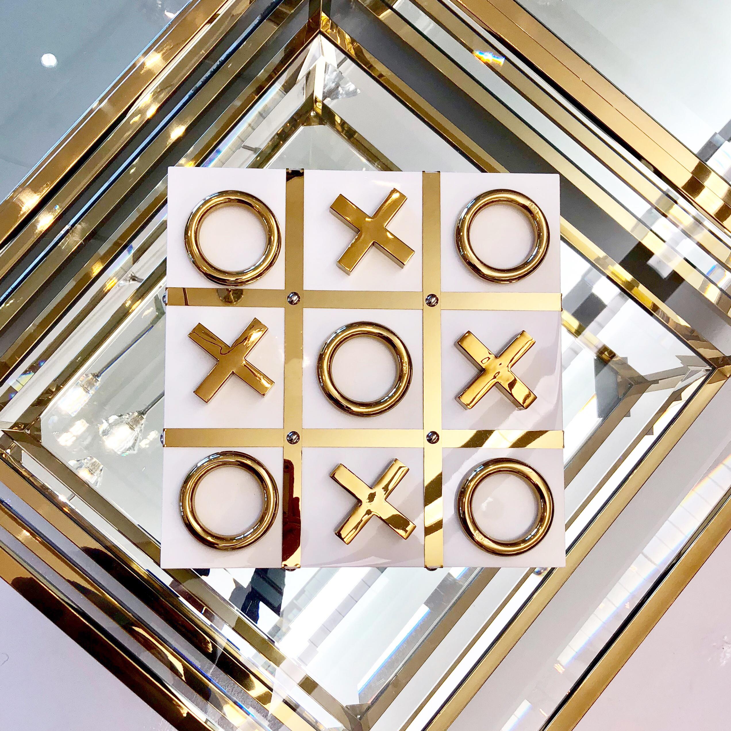 white and gold tic tac toe