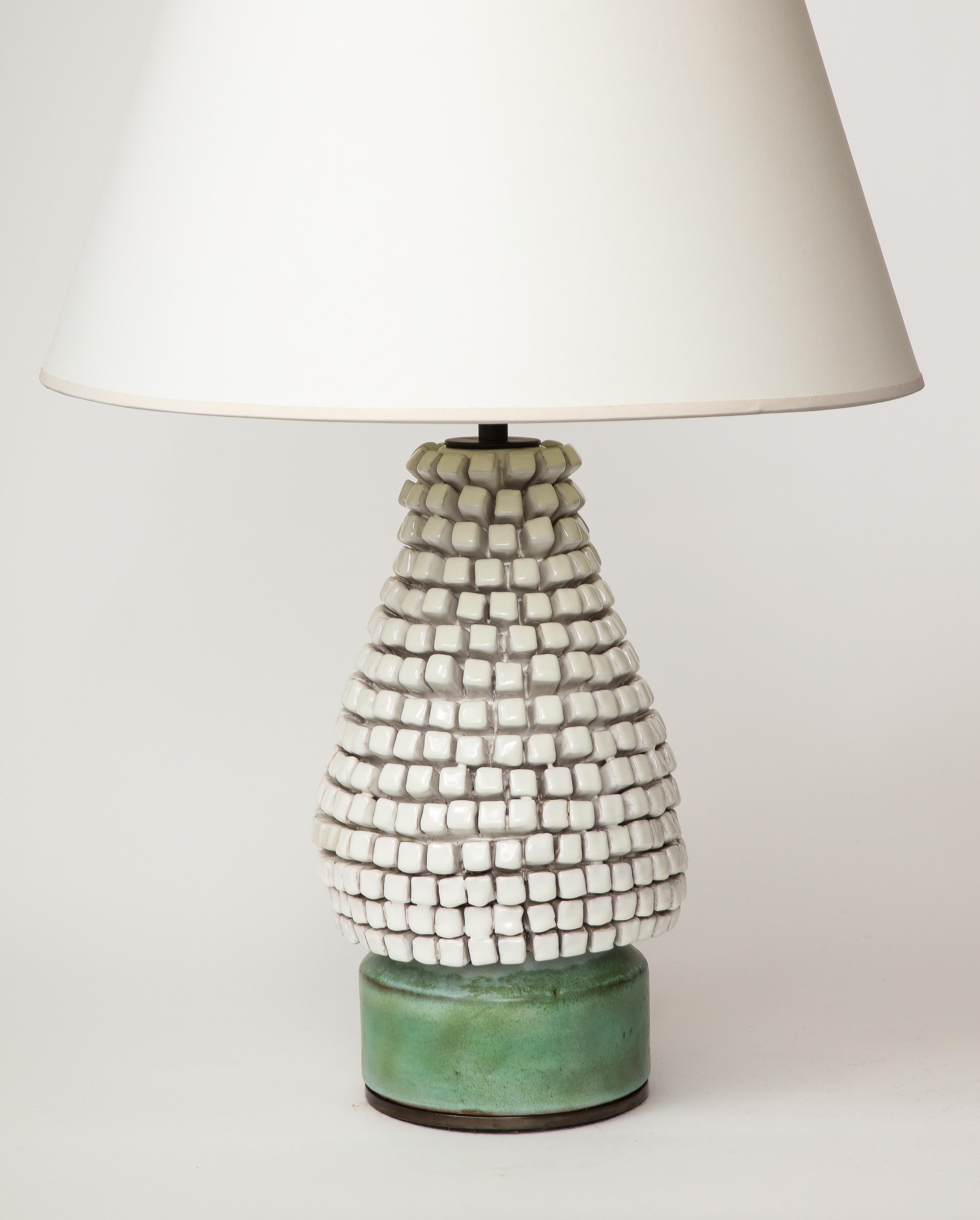 Unique, sculptural glazed ceramic table lamp. Newly rewired with a dimmer, black twisted silk cord, adjustable shade hard, and on/off switch at the cord.