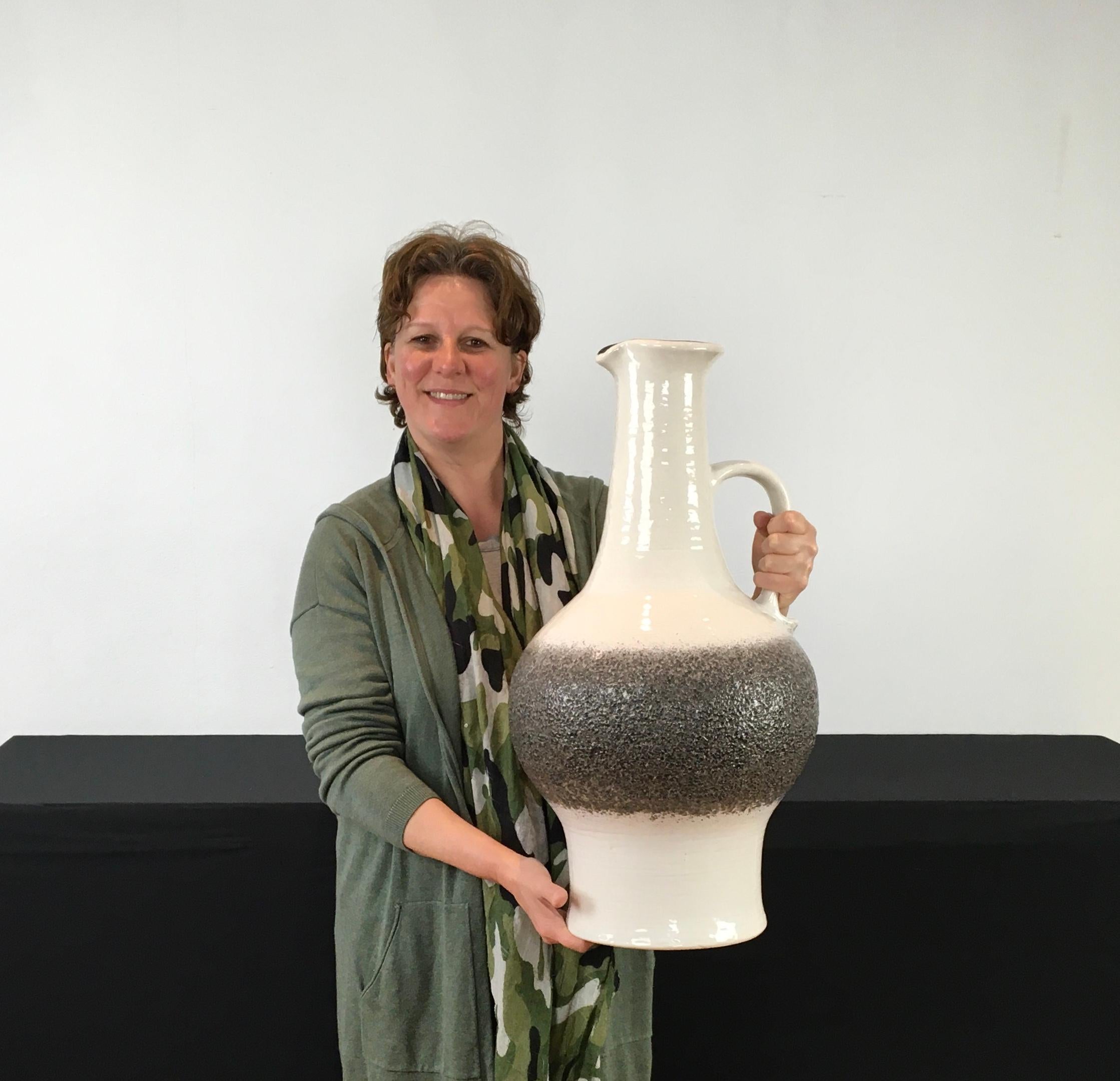 Large White en Grey Fat Lava Floor Vase with Handle 
by Jasba Keramik, W- Germany. 
A german Fat Lava vase with fat belly or bold vase with thick grey grain on. 
The neck of the vase is not round but in the shape of a spout - the inside is black.