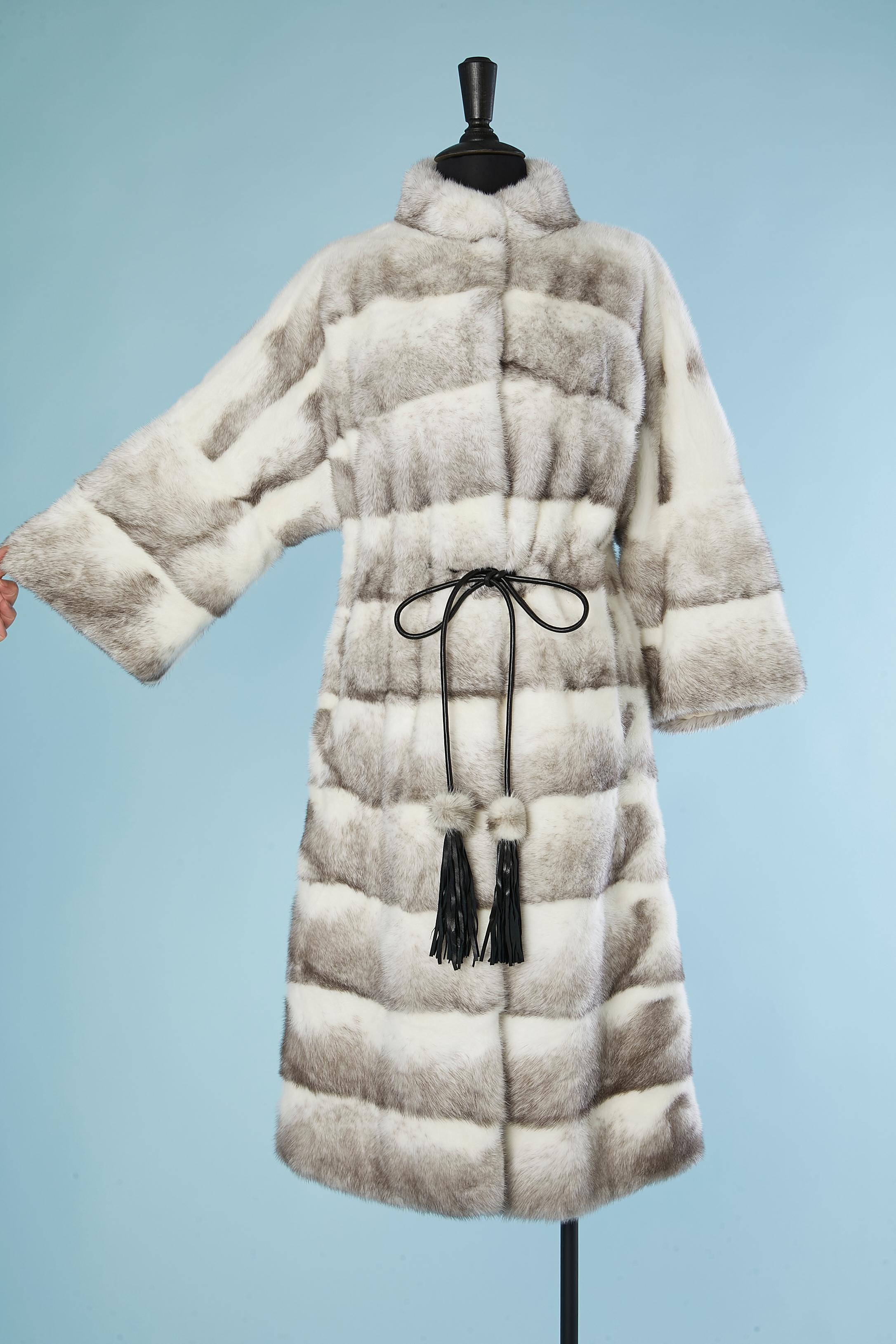 White and grey Platinium Quality Mink coat with black leather belt ( lap belt) and leather fringes pompoms. Mink quality is 