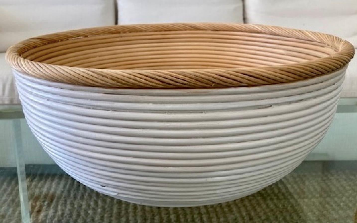 Beautiful white and natural rattan center piece. We have two of these pieces in stock, and also another similar pair in a larger size so collect all!