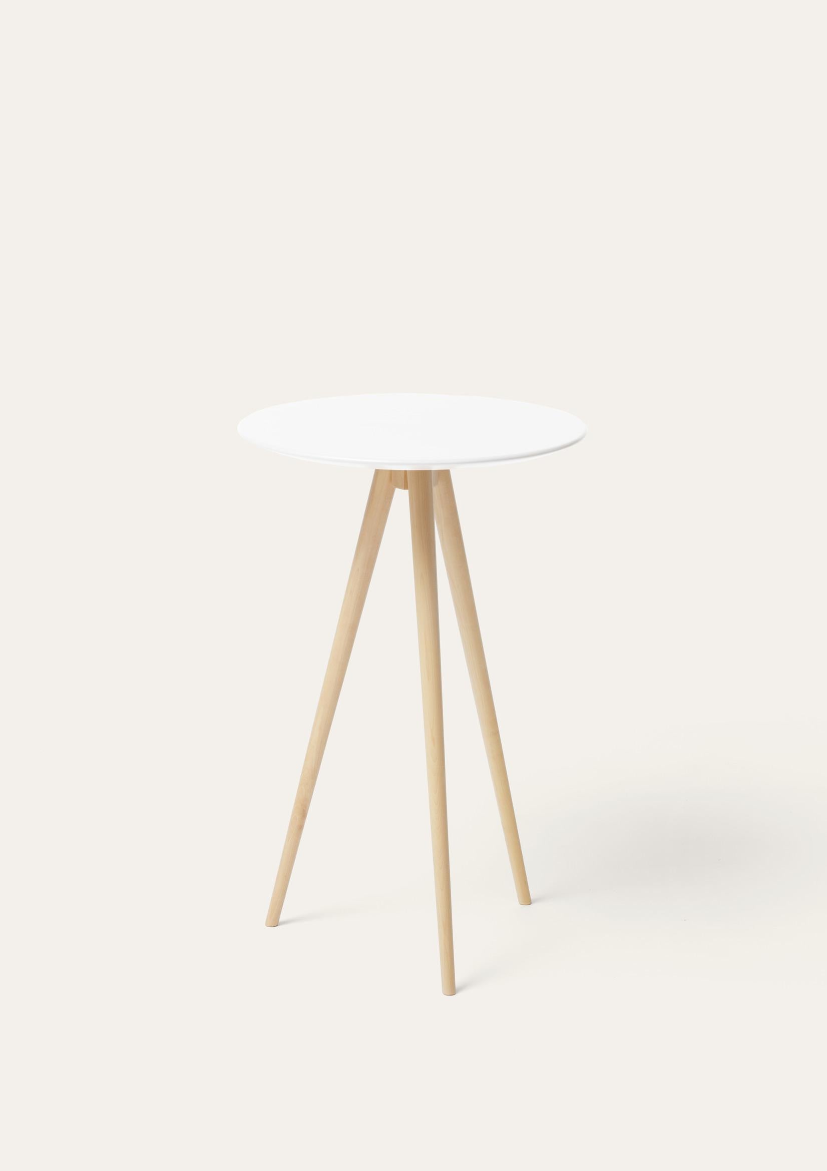 White and natural Trip side table by Storängen Design
Dimensions: D 35 x H 62 cm
Materials: birch wood.
Also available in other colors.

Trip is our smallest table, a lightweight three-legged surface entirely made of birch. A decorative item
