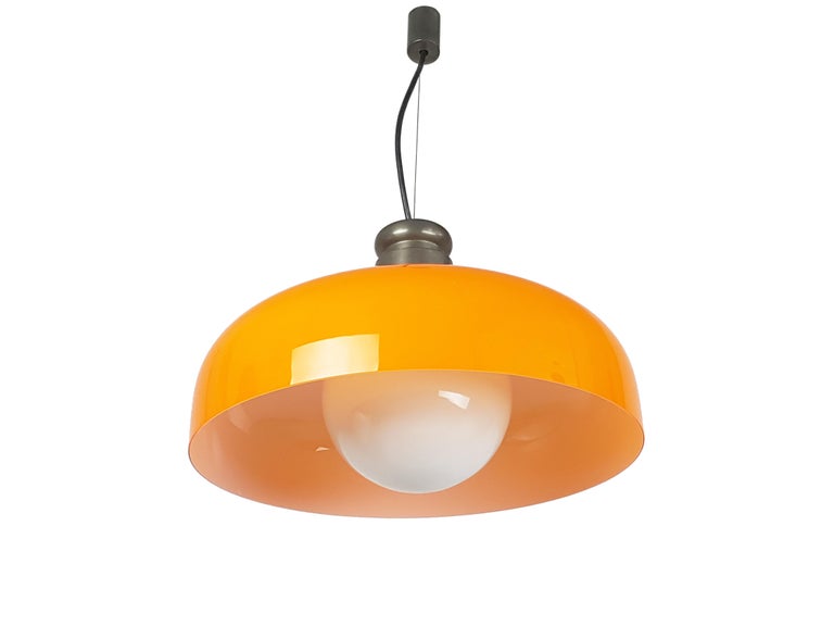 This elegant Murano glass pendant is made from a burnished brass structure and two hand-made glass elements: an opaline spherical lamp shade and an “incamiciato” orange round shade.