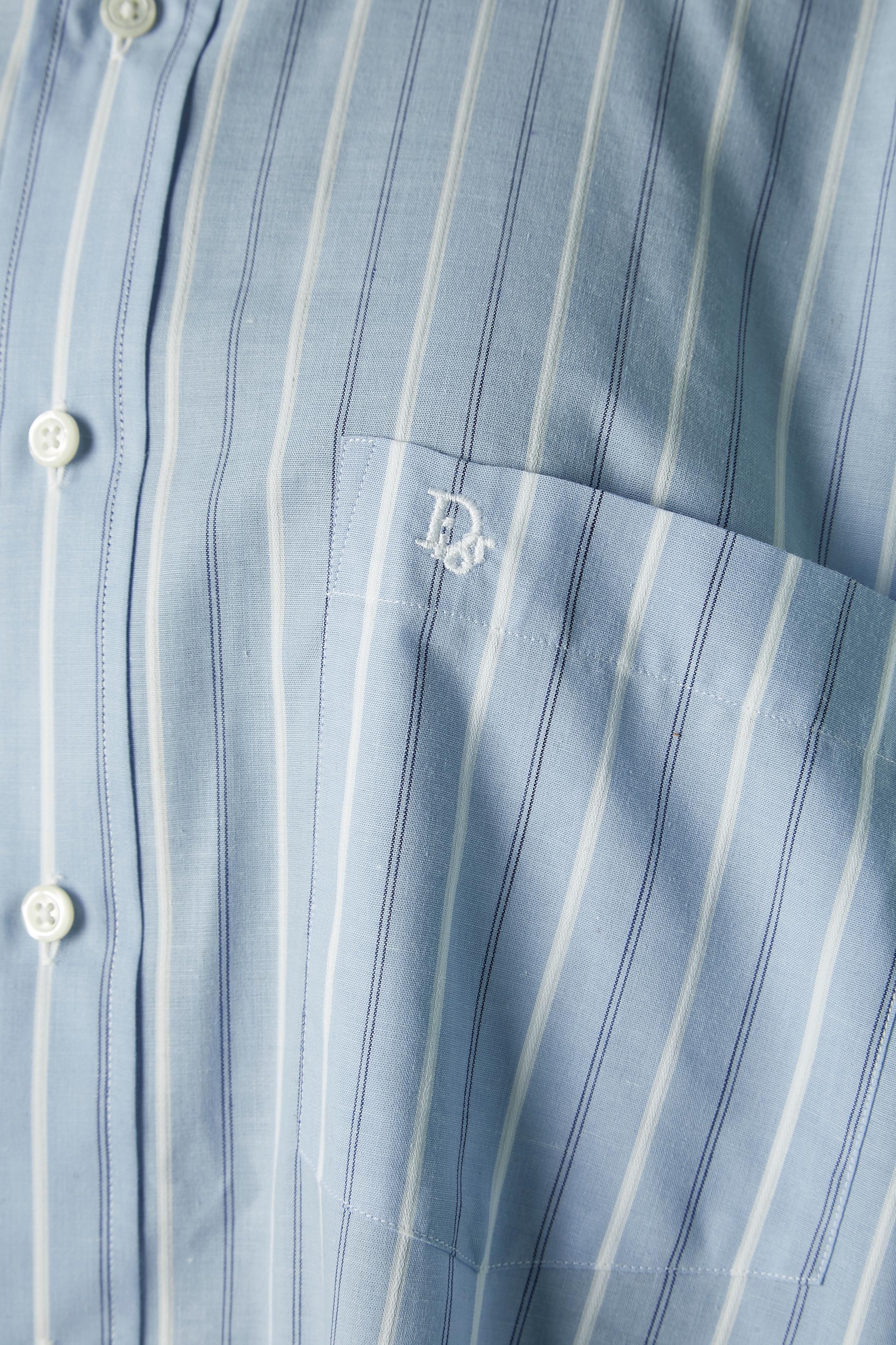White and pale blue striped shirt with white collar. Fabric composition: 50% cotton, 50% polyester. 
SIZE L ( 16 1/2 and 33 written inside the collar) 