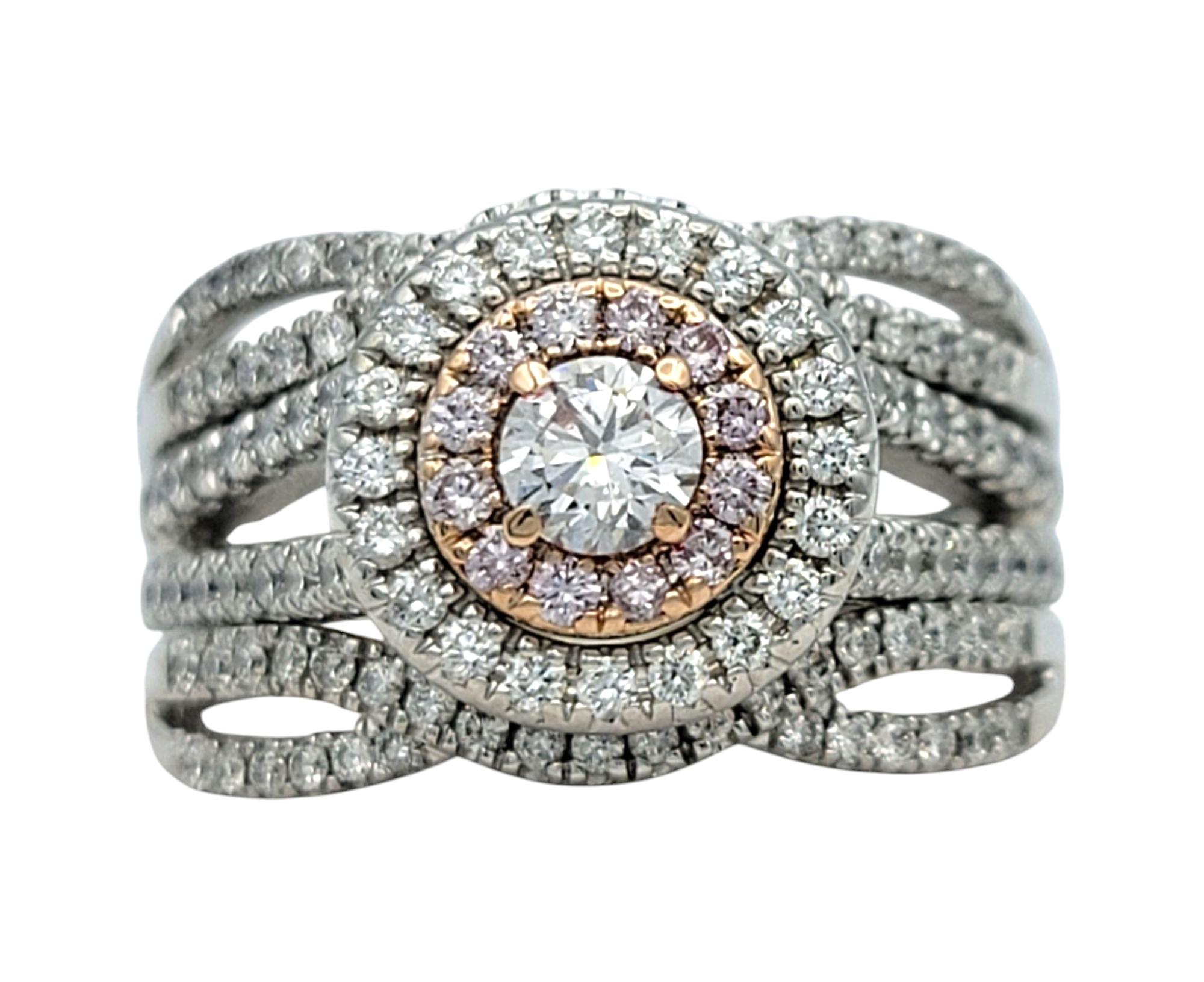 Ring Size: 7

Bold, radiant, and undeniably glamorous, this diamond ring commands attention with its showstopping design. Set in a fusion of 14 karat white and rose gold, the ring features a dazzling array of round brilliant cut white and pink