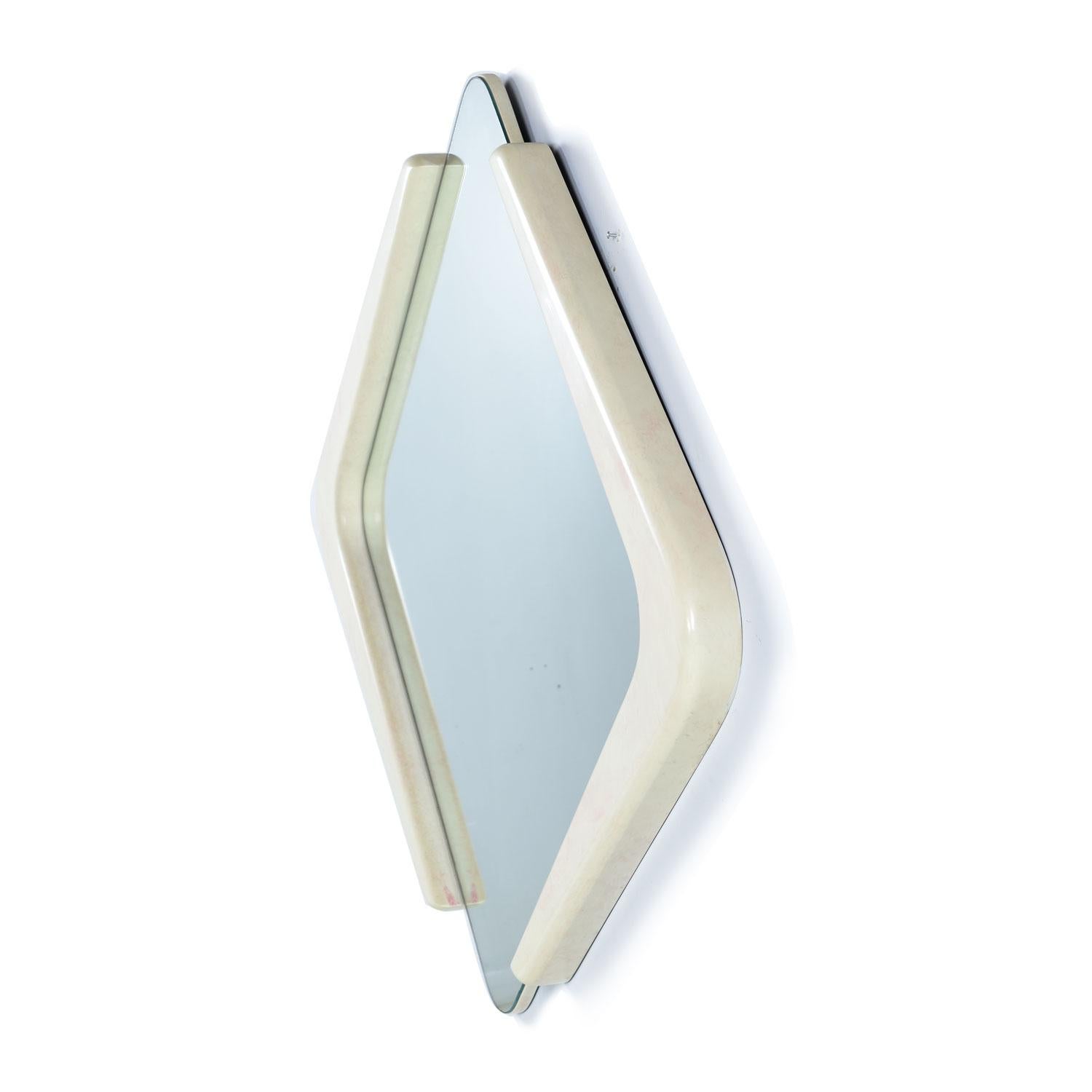 This diamond shaped white lacquer mirror was designed by Karen Cooper for Finish Design. This Memphis style faux marble mirror commands attention. The white lacquer has faint pink blushes and veins mimicking the effect of fine Italian Marble.