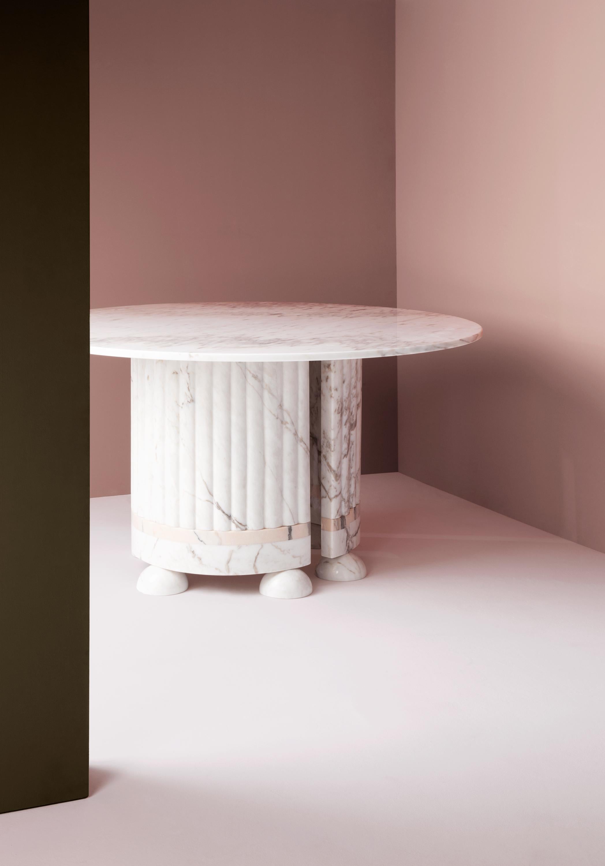 Memphis Dinner Table by Dooq
Ø 130 cm 51”
H 77 cm 30”

Materials: estremoz rose and white Marble

Dooq is a design company dedicated to celebrate the luxury of living. Creating designs that stimulate the senses, whose conceptual approach is inspired