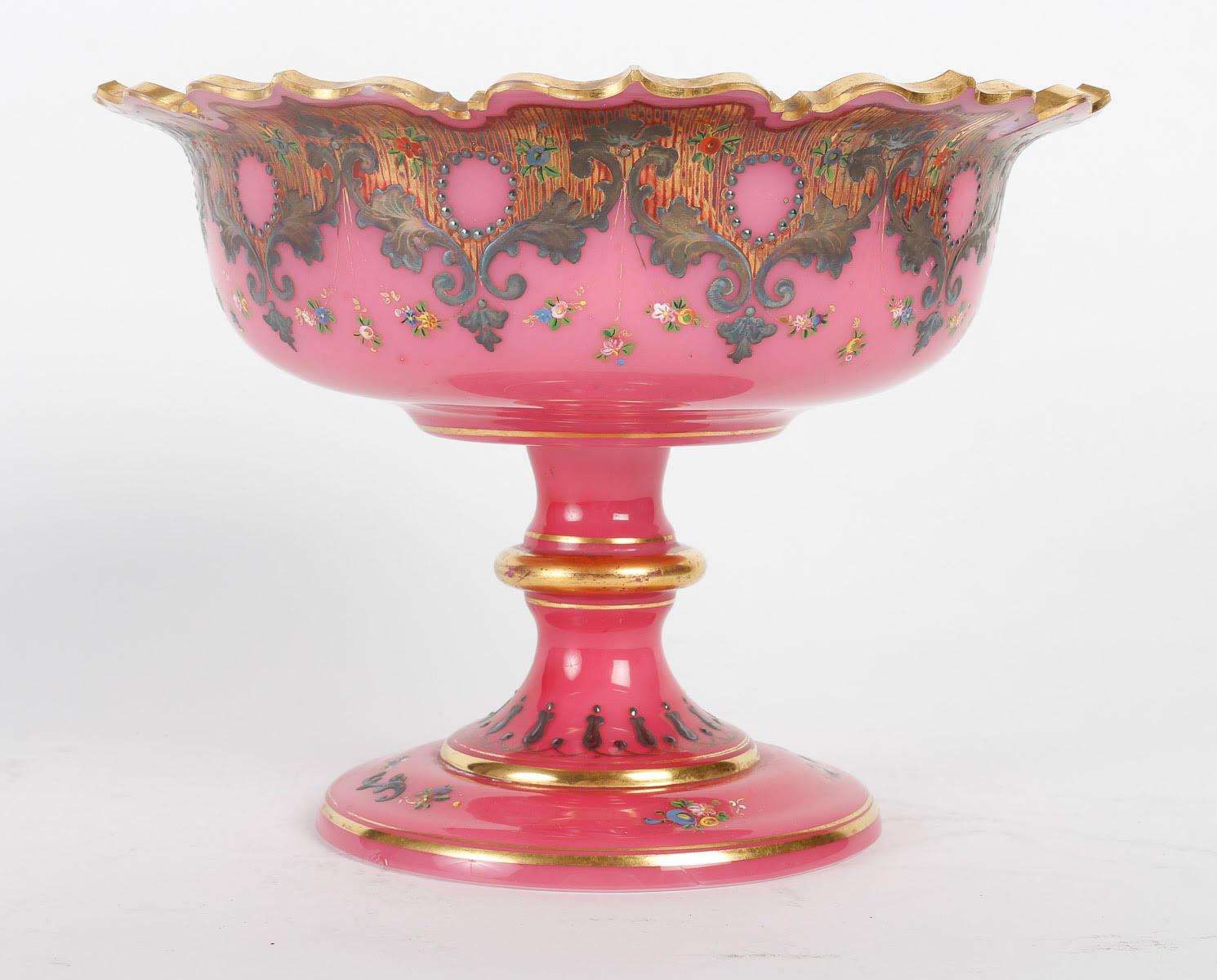 White and pink opaline service enamelled with silver and gold, 19th century.

White and pink opaline coffee or tea service enamelled with silver and gold, consisting of two coffee cups, a fruit bowl and a milk jug, 19th century, Napoleon III