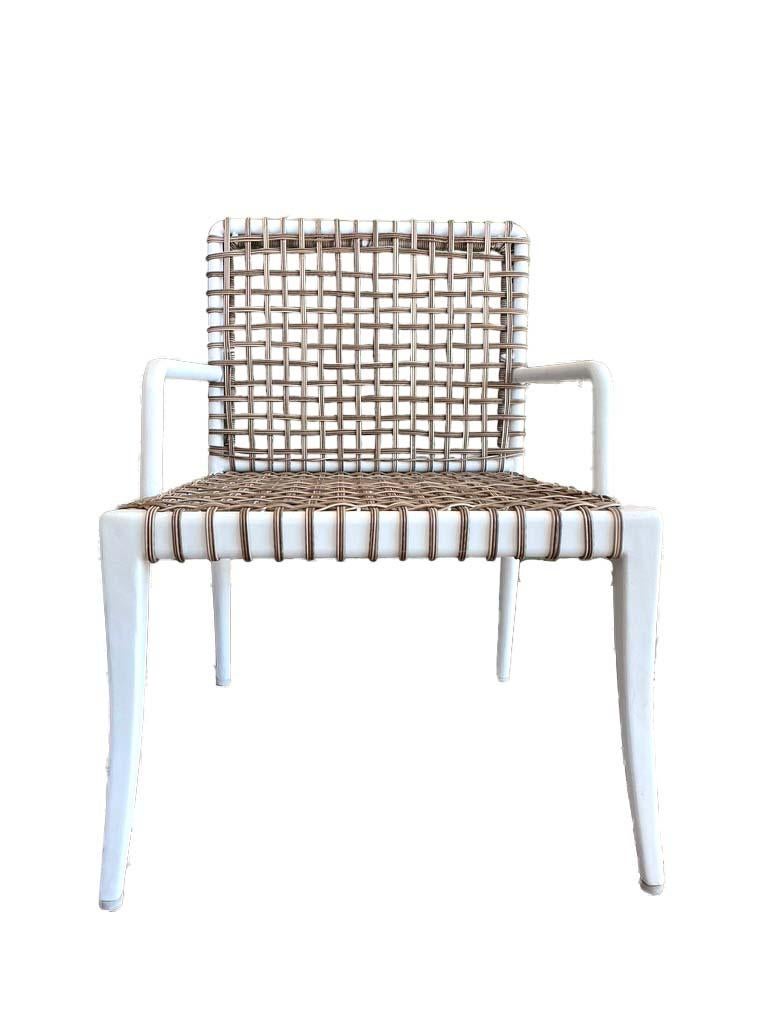 Set of eight fabulous dining or side chairs in white metal with weather resistant rattan. These chairs can be used inside or outside and are reminiscent of Michael Taylors style and design. they can be used without a cushion, or a thin cushion could