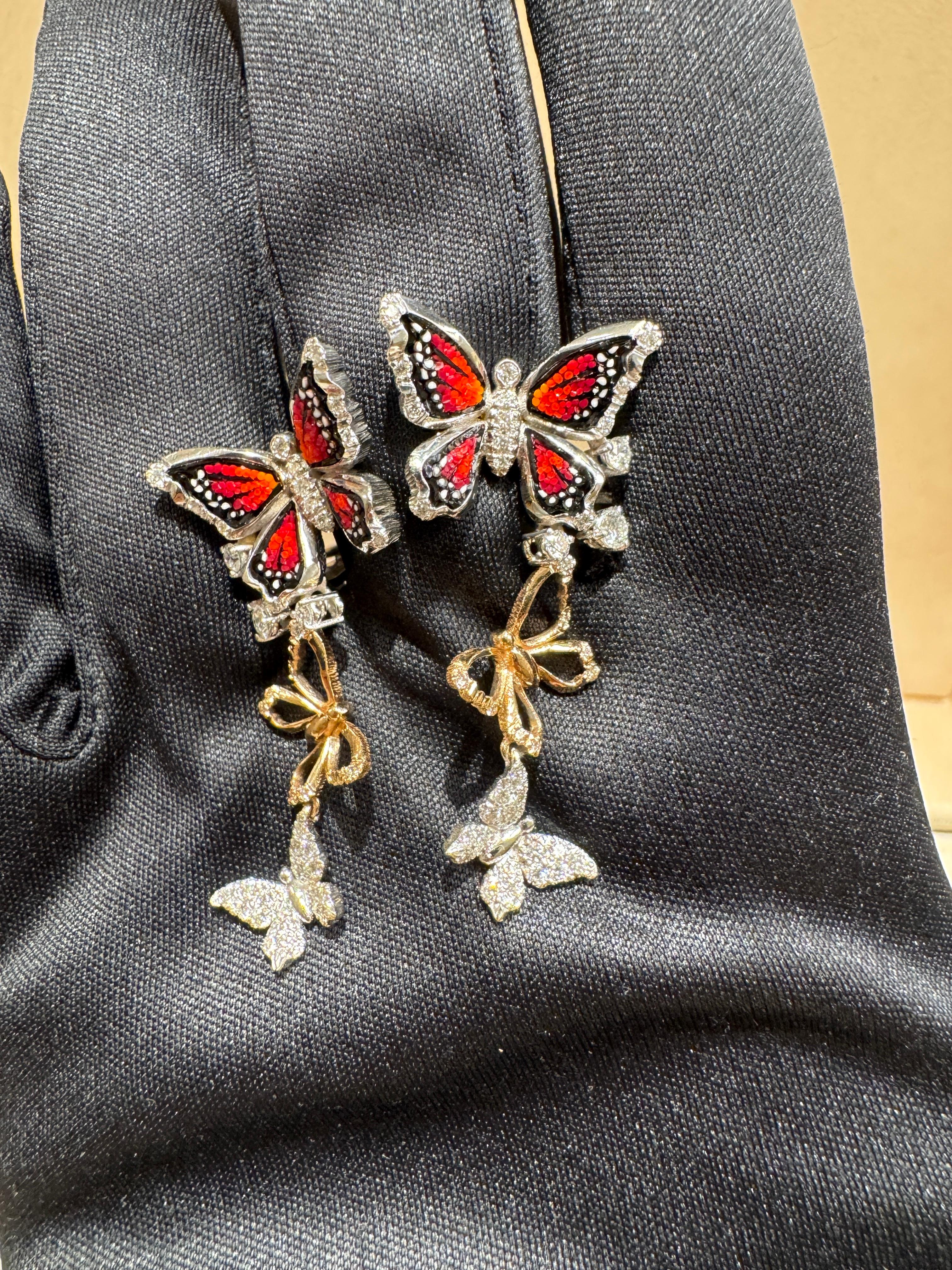 The unmatched beauty and elegance of butterflies, as mysterious as they are captivating, evoke the graceful rhythm of a dance—fluid, harmonious, and full of movement.
Delicate butterflies in gold and sparkling diamonds, decorated with micromosaic