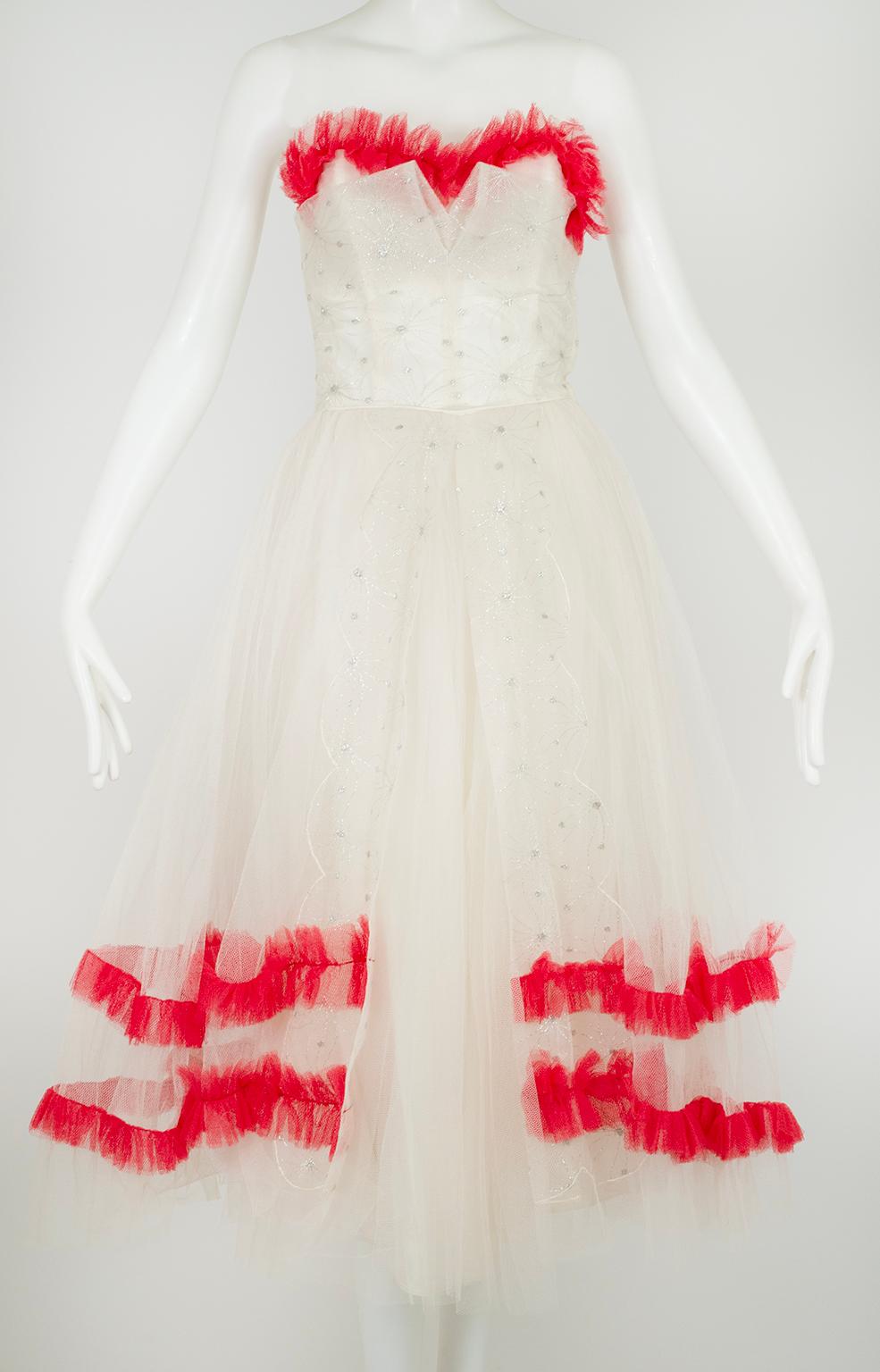 Why not throw a little Hell-bent red into your virginal white dress?  The silver filigree embroidery imparts a distinctly Nutcracker-Ballet-Snow-Fairy feeling, but the red implies pure “charm school dropout.”  A lovely exercise in contradictions