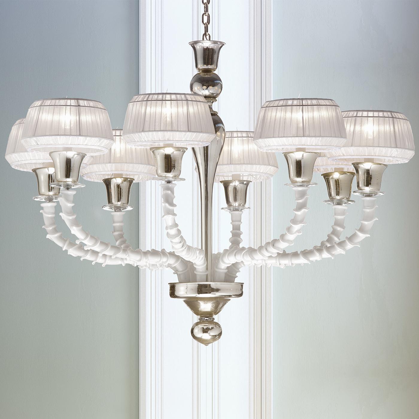 A superb mix of tradition and modernity, this magnificent chandelier combines the Rezzonico style of Venetian chandeliers with a contemporary twist. Handmade by skilled masters, Venetian mouth-blown glass is effortlessly blended in white with the
