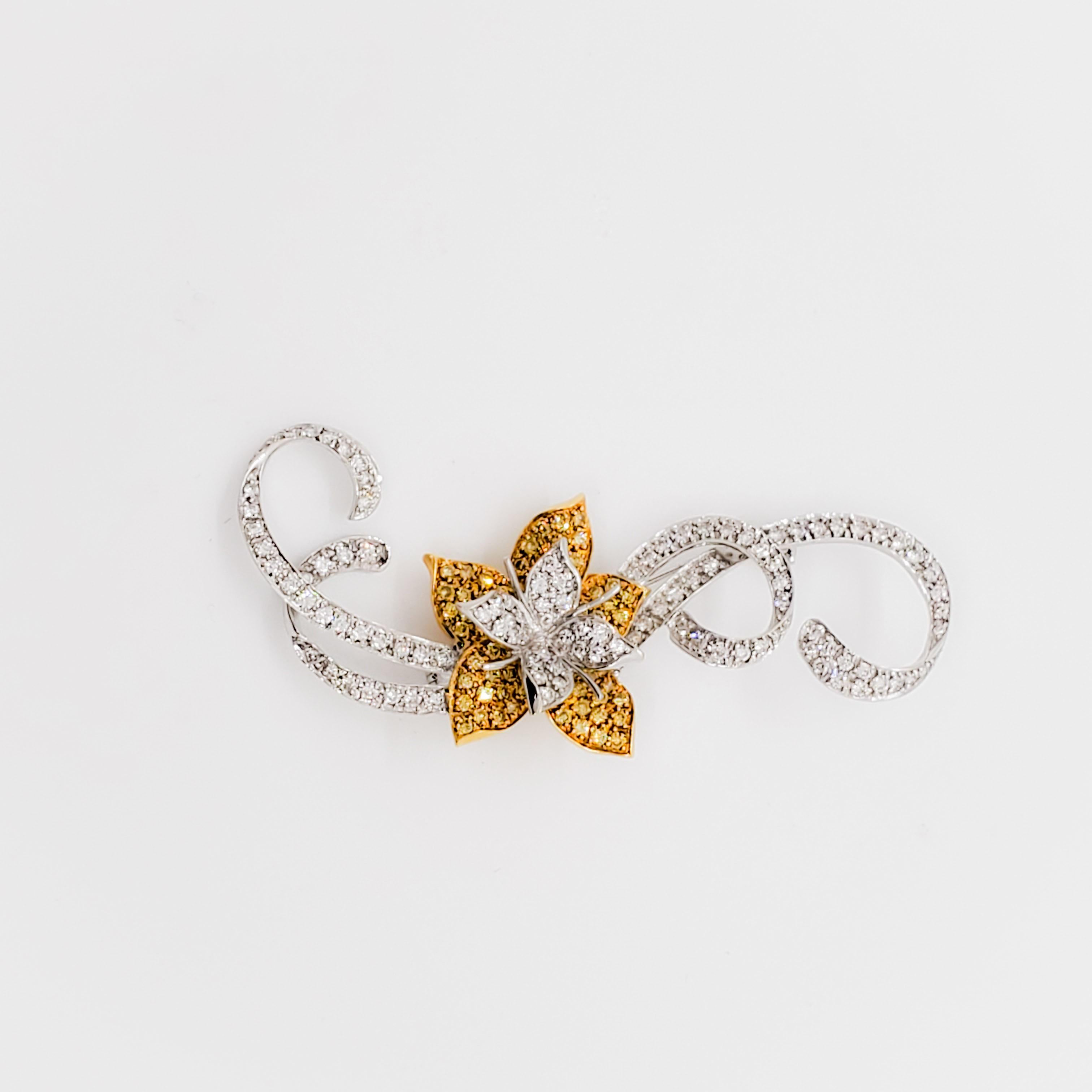 Gorgeous brooch with 2.25 ct. of good quality white and yellow diamond rounds.  Handmade in 18k yellow and white gold.  This brooch has a classy floral design and is very well made.