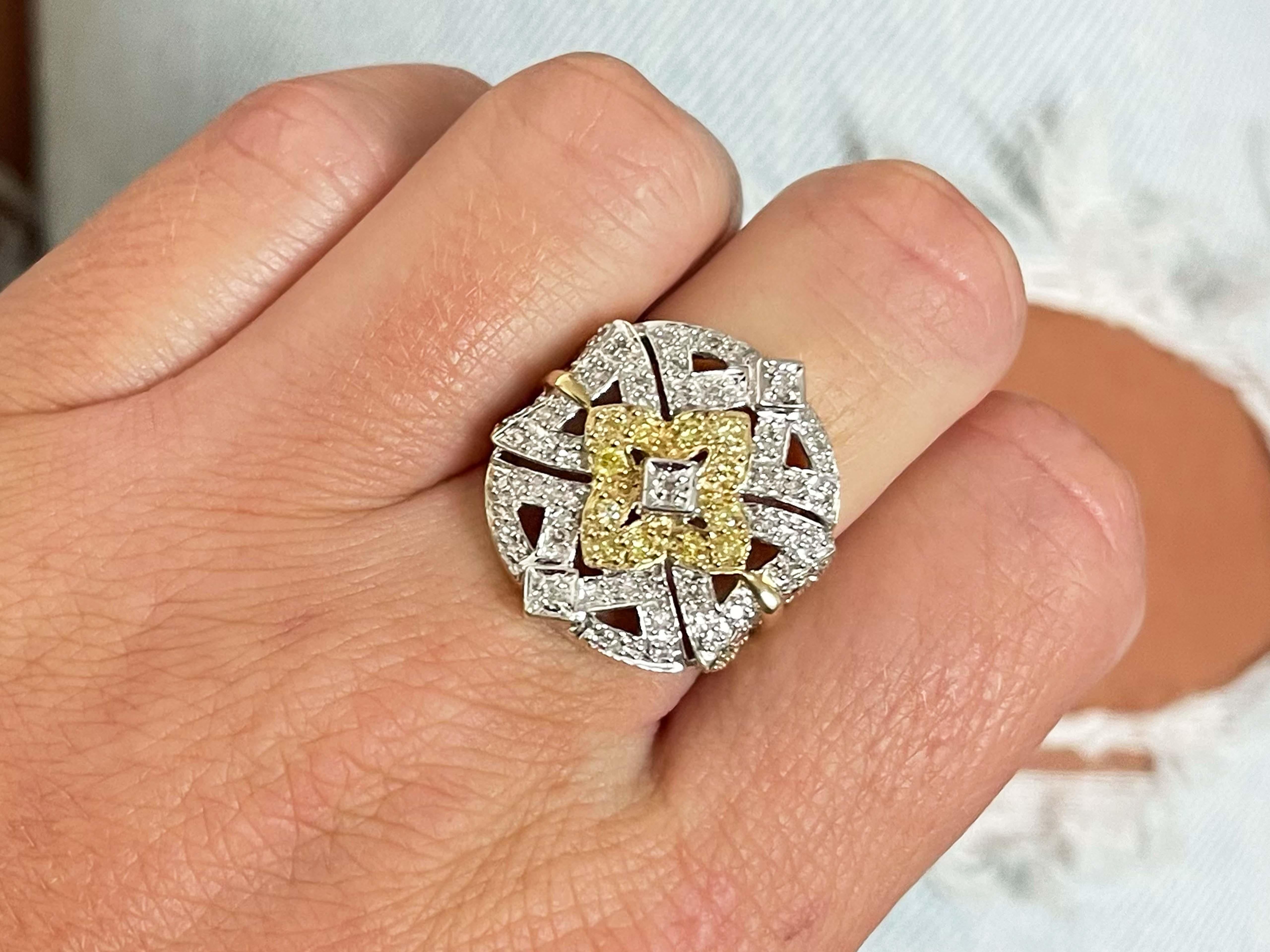 Item Specifications:

Metal: 14K White Gold

Style: Statement Ring

Ring Size: 6 (resizing available for a fee)

Total Weight: 6.50 Grams

Ring Width: 22.8 mm x 21 mm

White Diamond Carat Weight: ~0.20 carats

Yellow Diamond Carat Weight: ~0.15