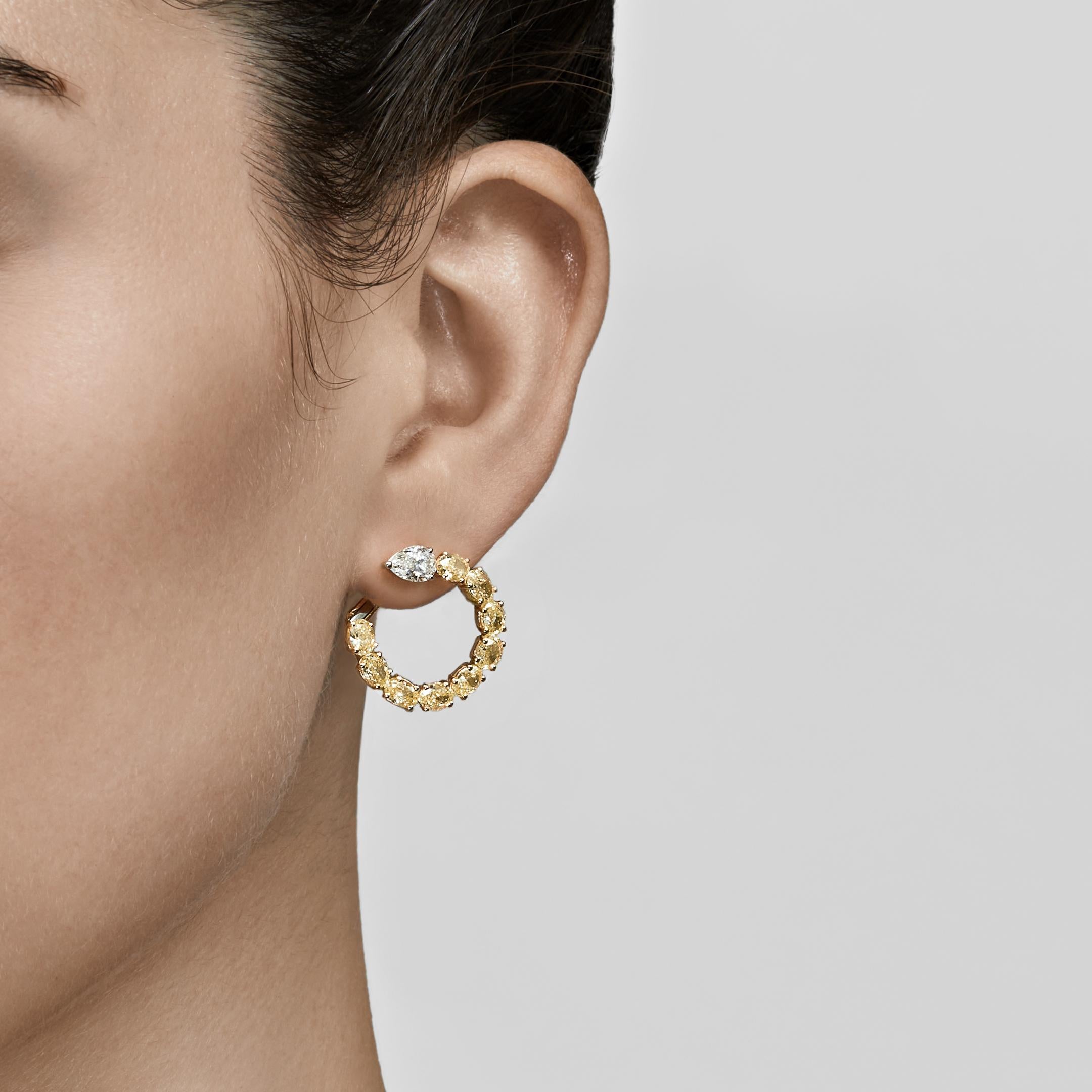 Hoop earrings are a fine jewelry necessity that works for so many occasions. Small huggie hoop lend polish to a humble errand run, while a large, luxurious pair becomes the focal point of your ensemble. These pear-shaped yellow and white diamond