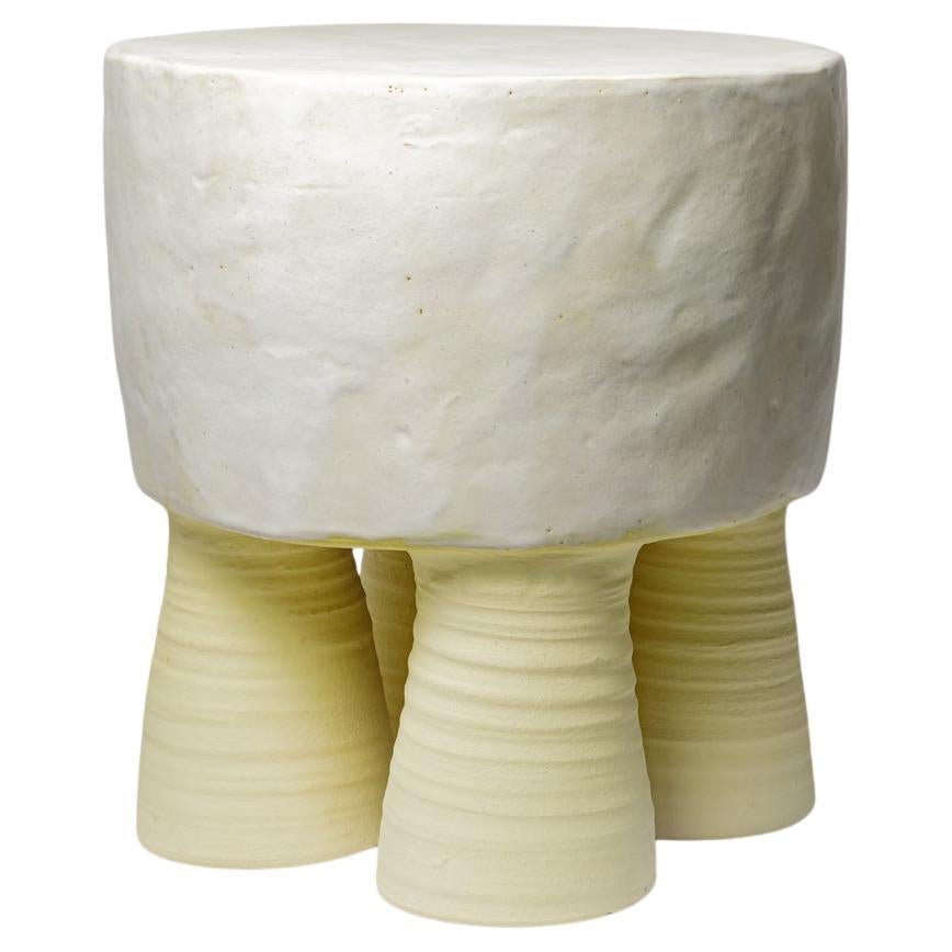 White  and  yellow glazed ceramic  coffee table or stool  by Mia Jensen, 2025.