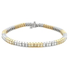 Bracelet en or blanc et jaune avec des diamants blancs et jaunes.