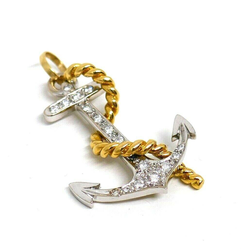 Anchor is a symbol of hope and a new adventure. This one came from 1970s; made of 18k white and yellow gold featuring round cut diamonds. Total diamond weight is 0.36 pt. Stamped with a hallmark for 18k gold and a maker's mark.
Measures 1,5