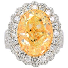 White and Yellow Gold Natural Fancy Yellow Oval Diamond Engagement Ring