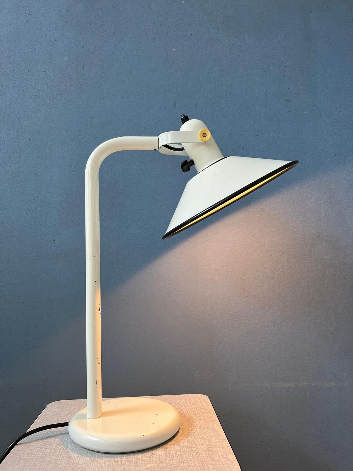 Very rare mid century desk lamp by Anvia. The has a white, metal frame with a black finish on the edge. The shade can be easily adjusted in position, see pictures. The lamp has a black switch on top of the shade. The lamp requires one E27 (standard)