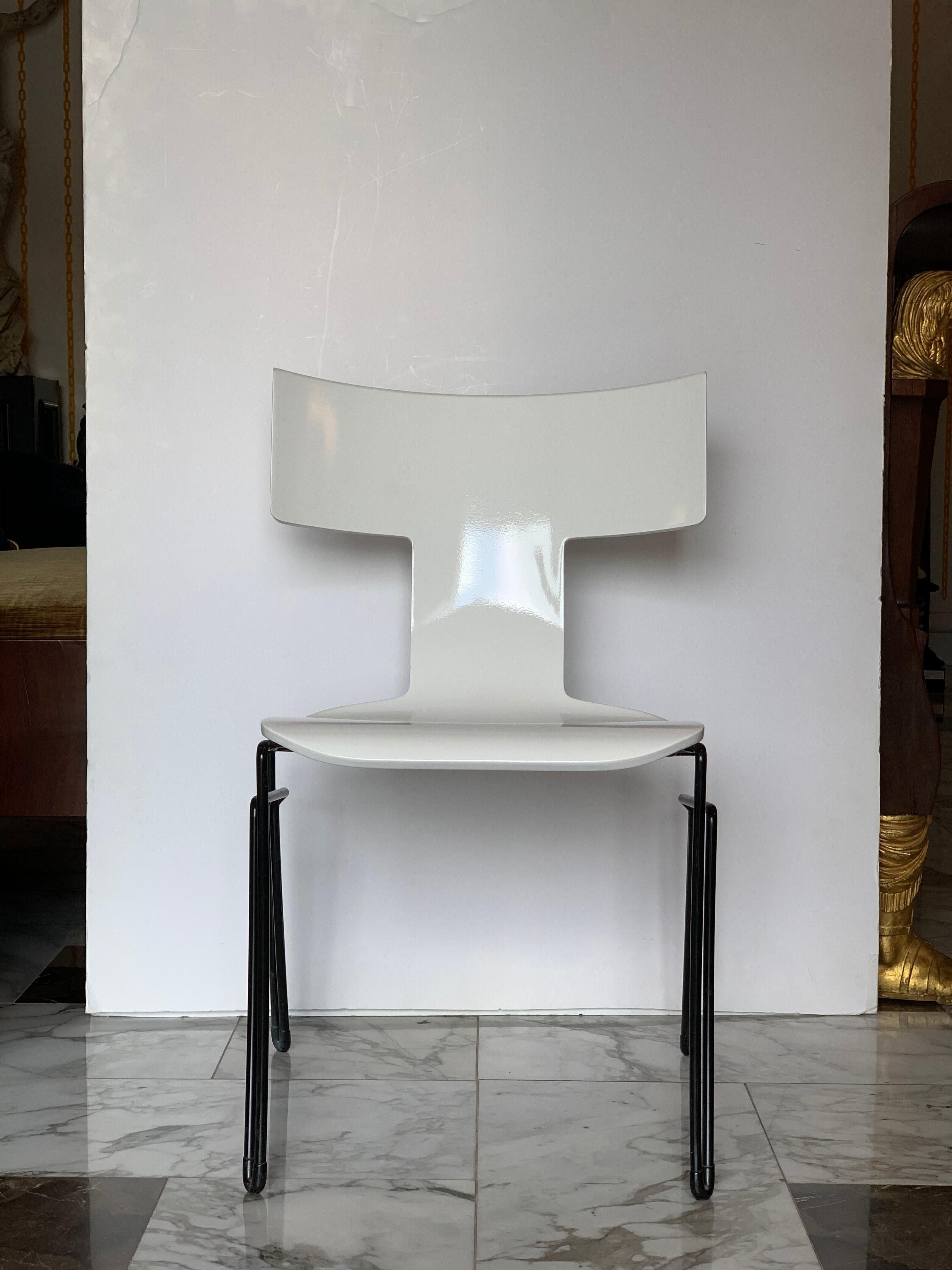 Klismos-style Anziano chairs, designed by John Hutton for Donghia, circa 1989. Vintage restored bright white molded beechwood seats with black powder-coated tubular steel frames and original black rubber floor protectors.
With its combination of