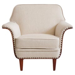 White Armchair with Stained Beech Legs and Decorative Studs