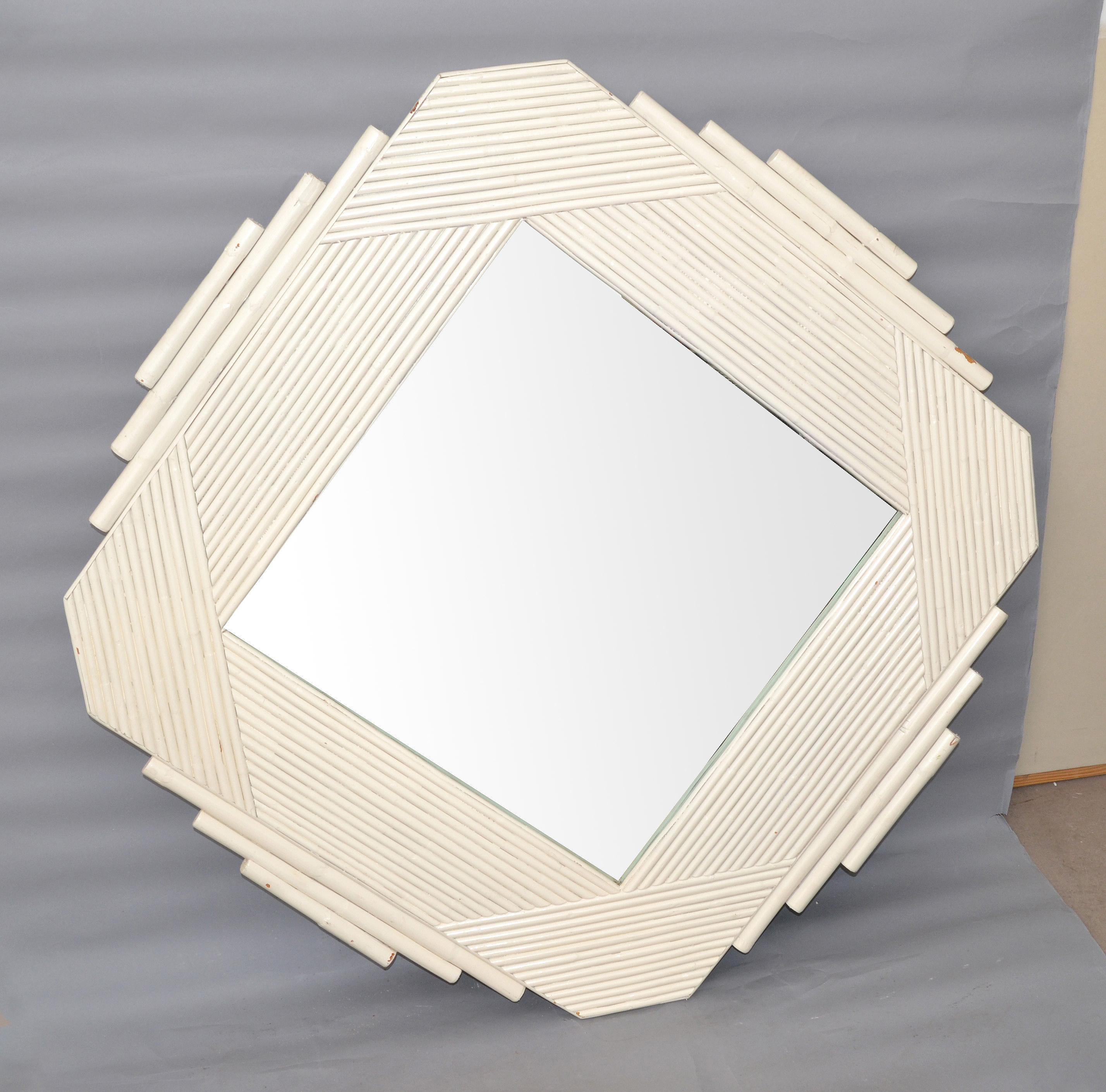 Mid-Century Modern bamboo & wood wall mirror in geometric shape.
Handcrafted American Craftsmanship.
Can be hung in a variety of angles.
Mirror size: 21.5 x 21.5 inches.