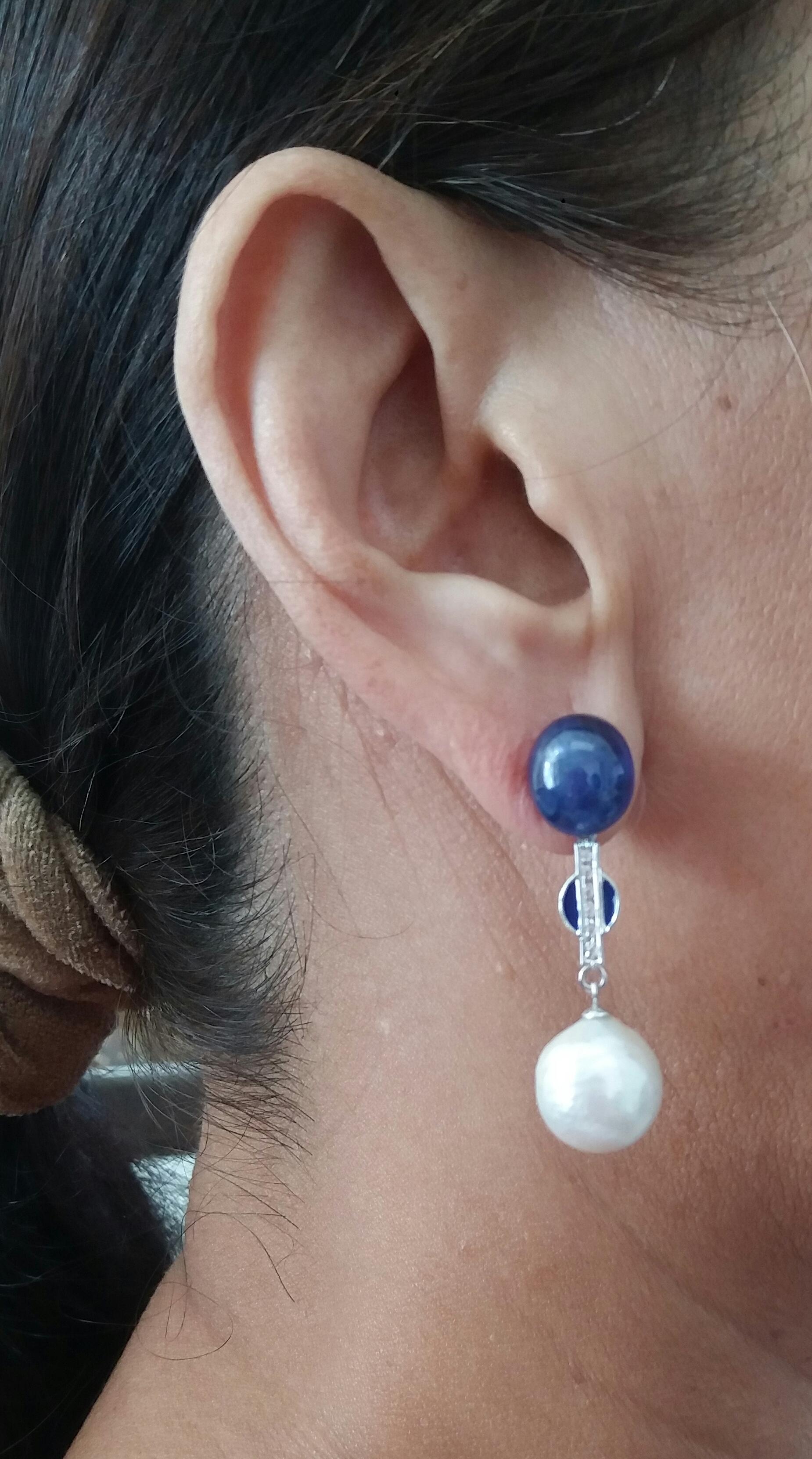 2 large blue sapphire cabs are the upper part, then the central part is white gold diamonds and blue enamel, the lower part is composed of 2 white baroque pearls with a diameter of 12 mm.
In 1978 our workshop started in Italy to make simple-chic Art