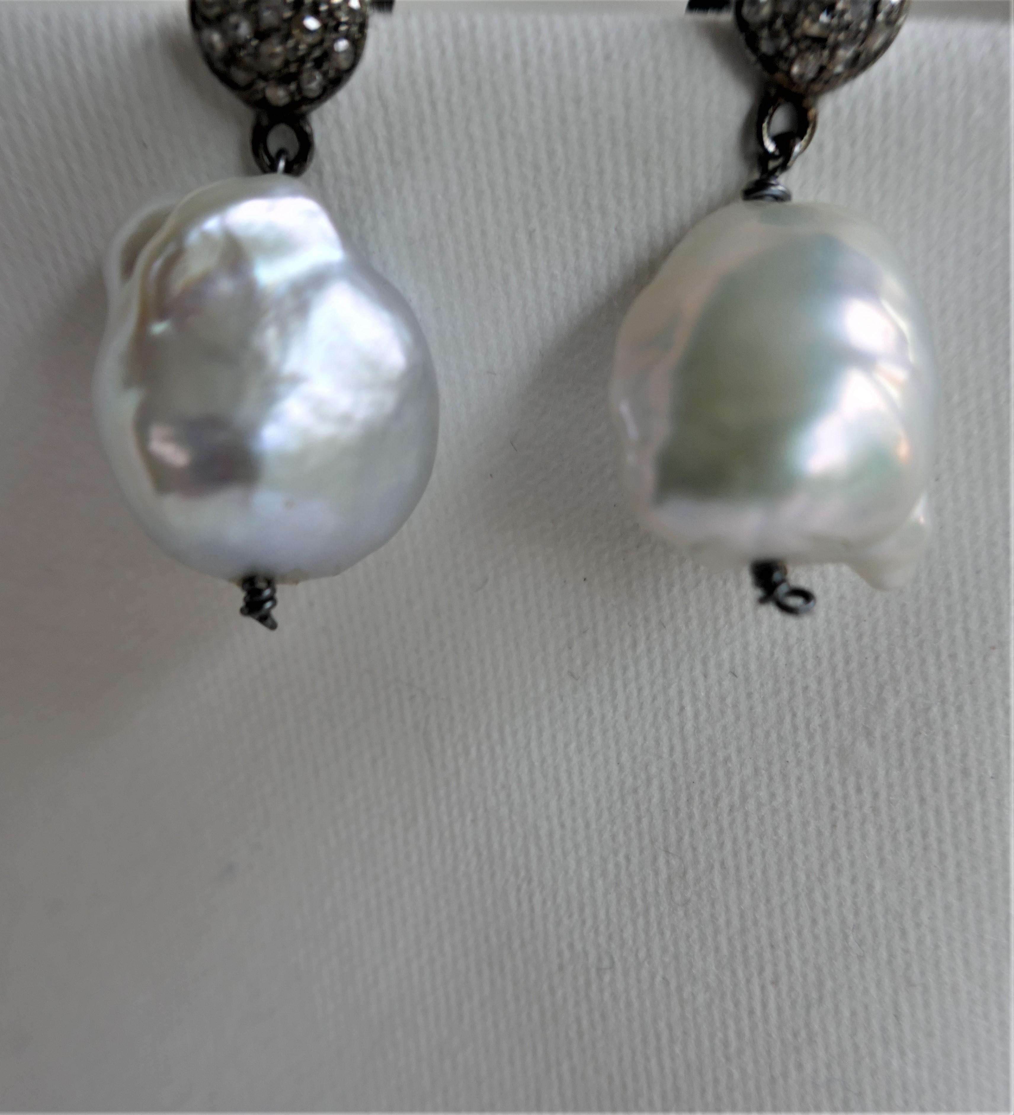 Love these earrings look beautiful on and are very wearable. The Baroque cultured  pearls are of excellent quality. These pearls are know as souffle pearls and are very light. The color is like a platinum white and are very luxurious. The pearls are