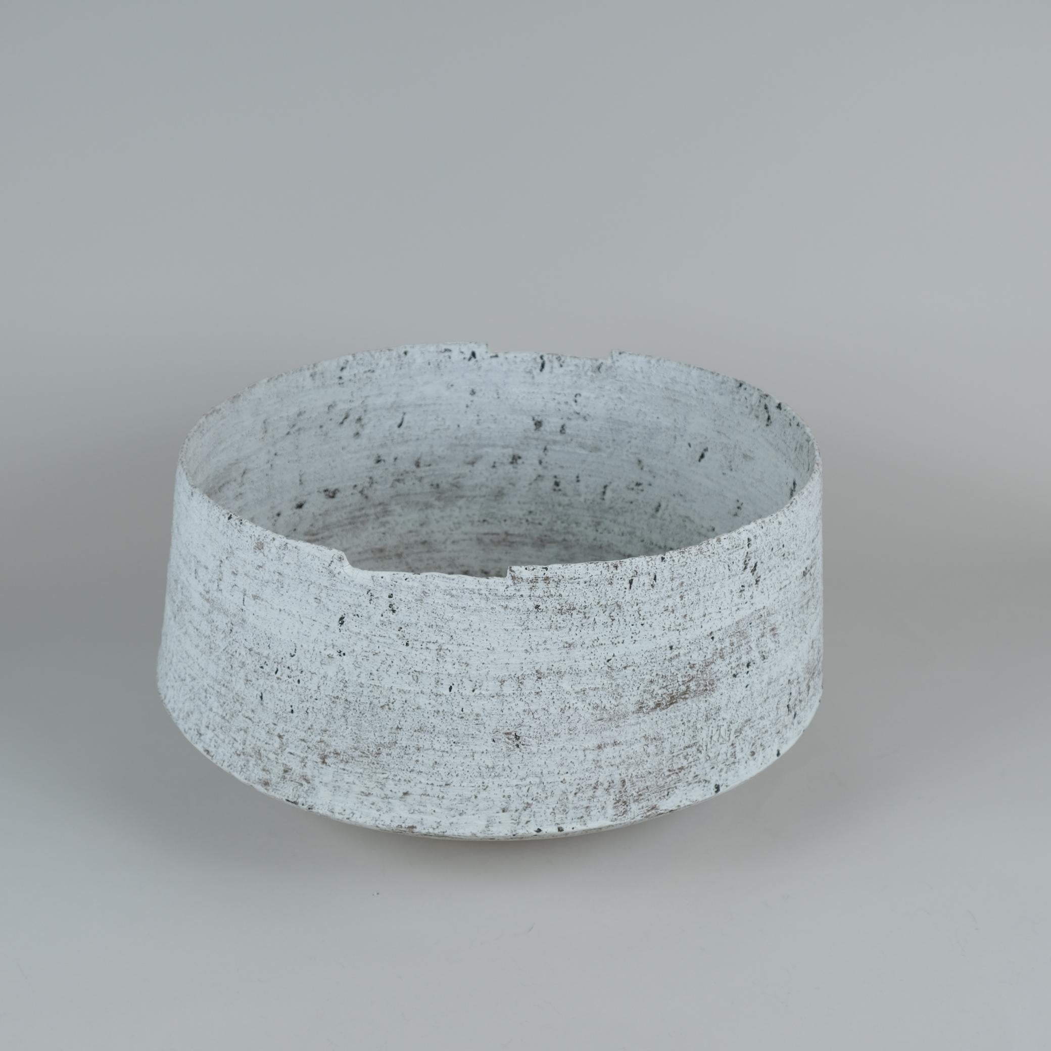 A beautiful unique ceramic art piece by Kati Tuominen-Niittylä, one of the most prominent modern Finnish ceramic artists and a member of the iconic Arabia Art Department Society.

This beautiful white basket like floor vase is hand made and hand