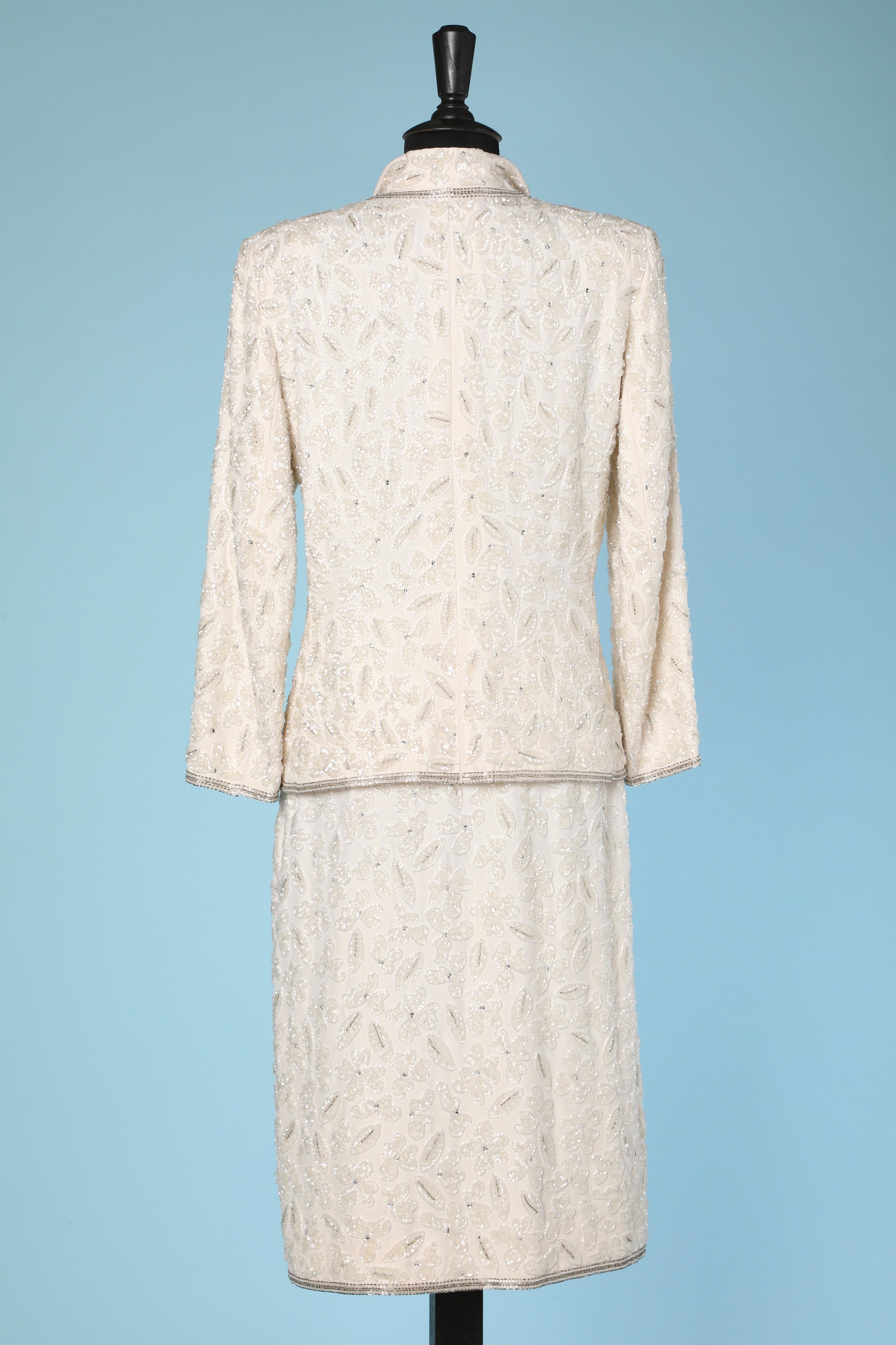 White beaded skirt-suit . No fabric composition tag but the main fabric and the lining are probably rayon. Thin shoulder-pads.
Jacket's Size : 42 ( Fr) L 
Skirt Size : 38 (Fr) M 