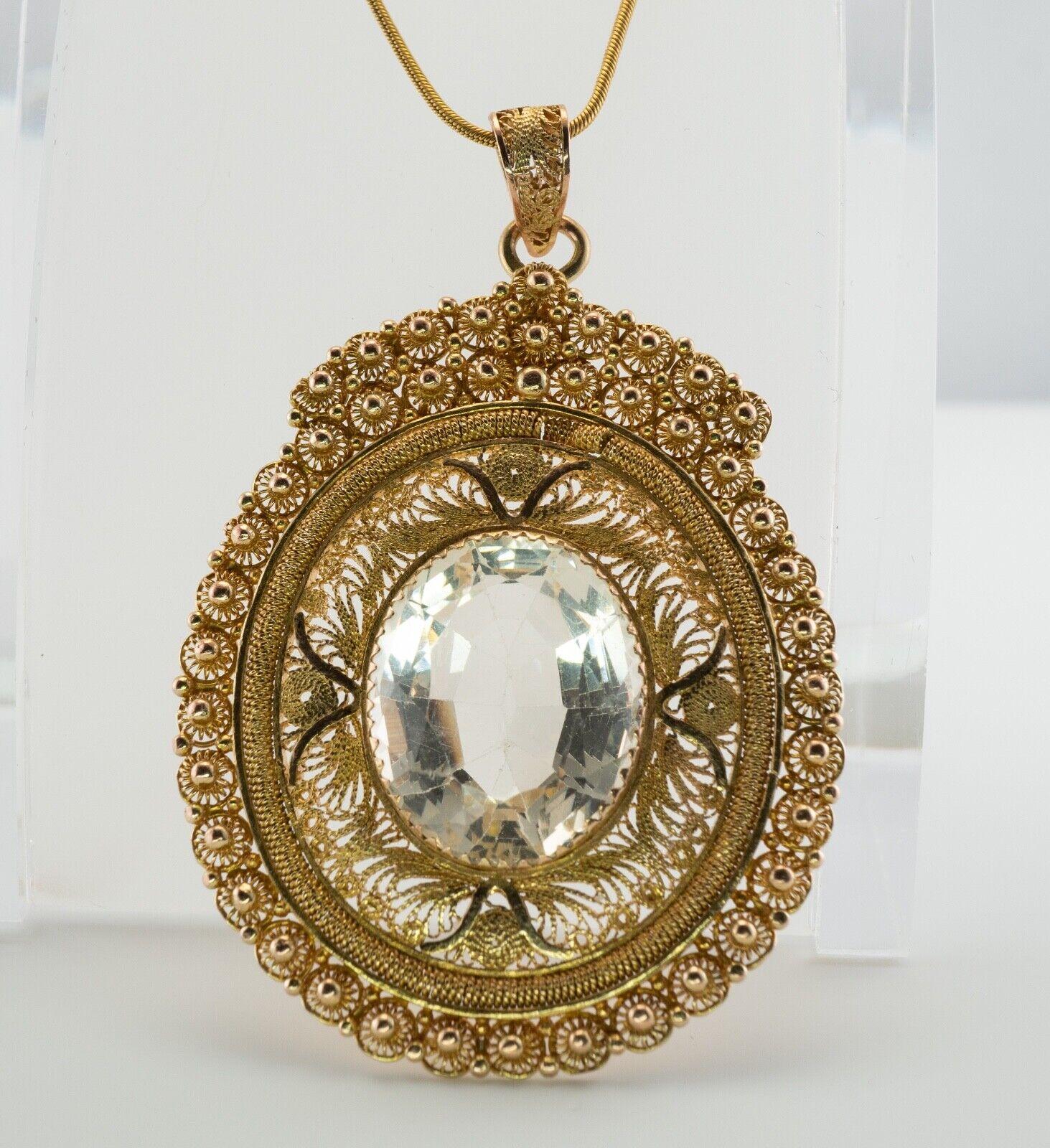 White Beryl Large Pendant 14K Gold Vintage

This one of a kind vintage pendant is finely crafted in solid 14K Yellow gold (carefully tested and guaranteed). The center stunning stone measures 20x16mm. We're not sure what stone it is, but we