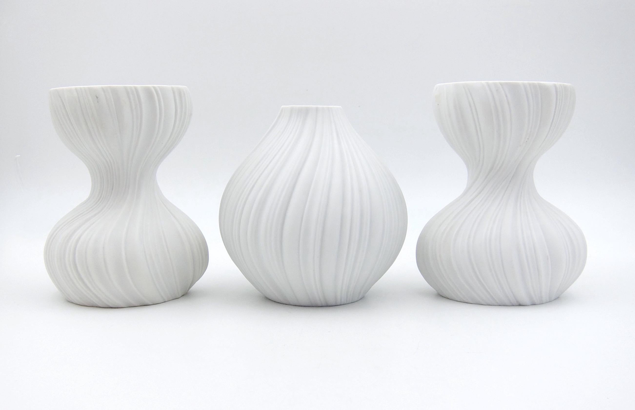 A vintage vase with matching candle holders in white porcelain designed by Martin Freyer (1909-1975) for the Rosenthal Porcelain Factory of Germany in the late 1960s. The modern design was called Plissée [pleated] after the crisp lines in relief