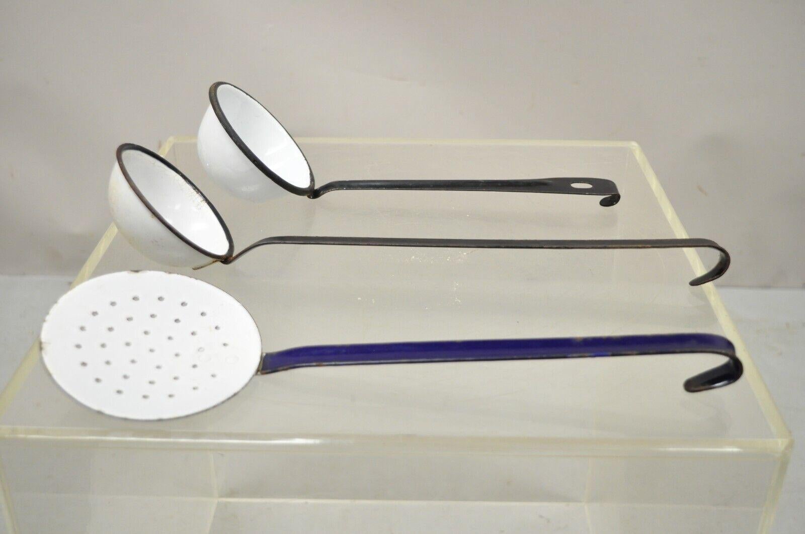 White black blue porcelain enamel French County water dipper ladles - 3 pieces. Item features (2) black and white ladles, (1) strainer, very nice antique pieces. early 20th century.
Measurements: 
Large: 15