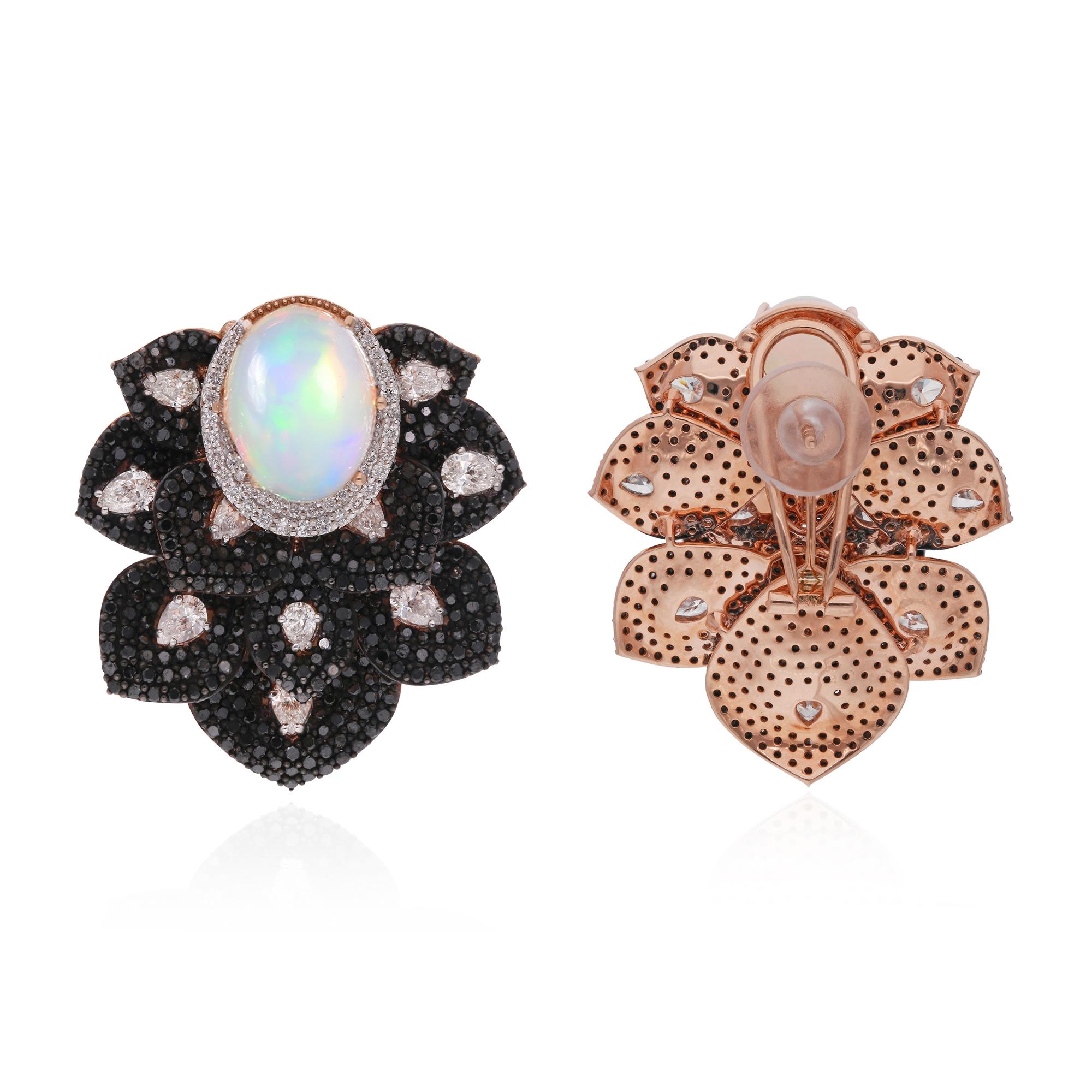 Elevate your jewelry collection with these striking white and black diamond stud earrings, adorned with opal gemstones and set in luxurious 14 karat rose gold. Each element of these earrings exudes elegance and sophistication, making them a standout