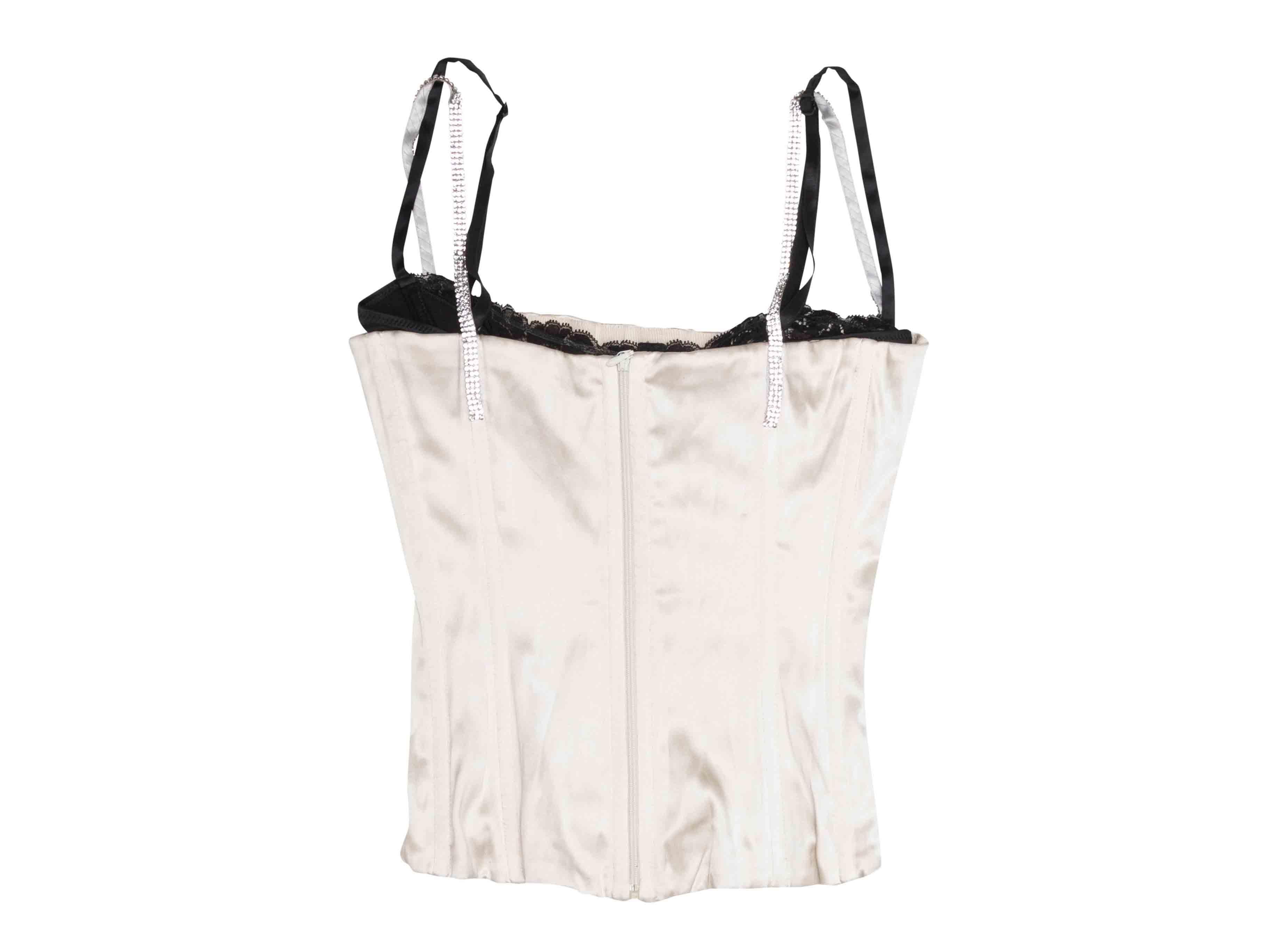 Top corseté en soie blanche et noire Dolce & Gabbana. Bretelles ornées de cristaux. Fermeture à glissière au dos. Poitrine de 25