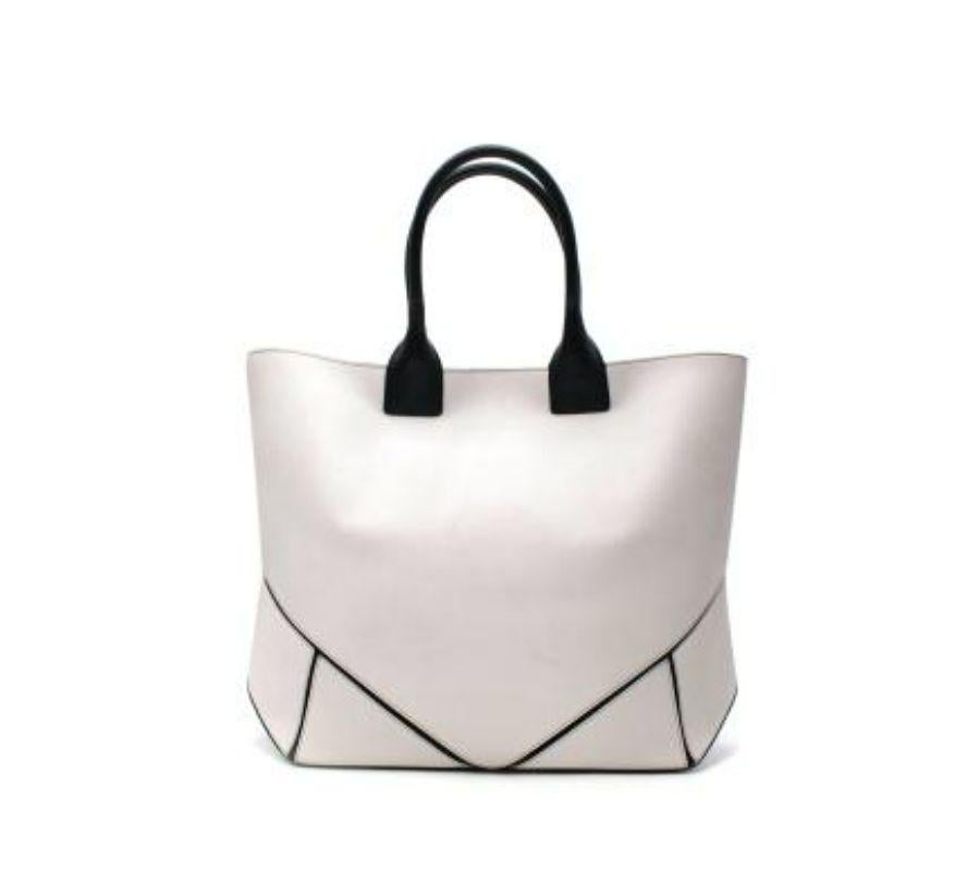 Givenchy White & Black Leather Easy Tote bag
 
 - Boxy white leather tote, with paneled base, revealing black leather underneath
 - Black leather rolled handles
 - Can be worn on hand and shoulder
 - Magnetic fastening 
 
 Materials 
 Leather 
 
