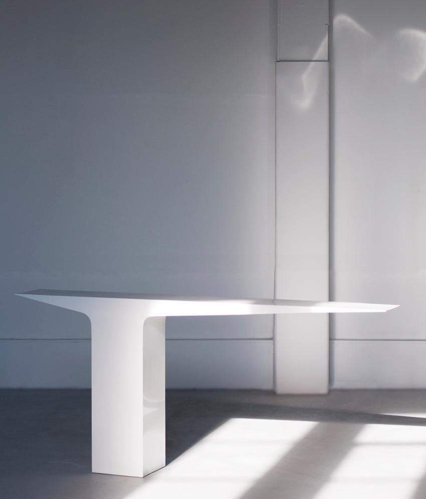 White Blade Console by Pol Quadens 
Limited Edition Of 8+4 Pieces.
Dimensions: D 30 x W 210 x H 95 cm.
Materials: Satinated stainless steel.

Pol Quadens was born in Brussels. His father was active in the fields of composites the metal industry, and