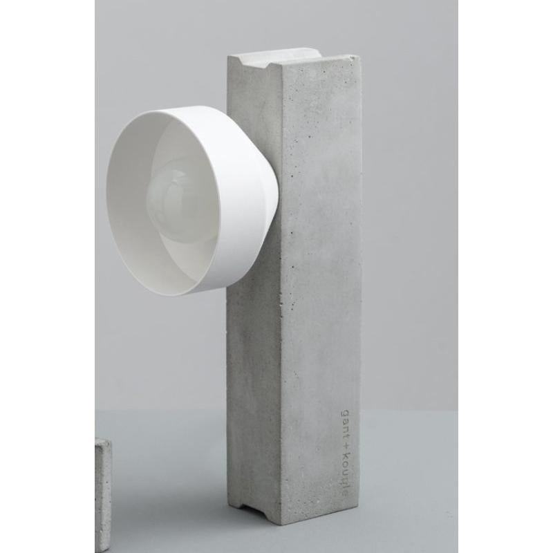 White Block Table Lamp by +kouple
Dimensions: D 26 x W 10 x H 12,7 cm.
Materials: Concrete, powder-coated steel and textile. 

Available in different color options. Please contact us.

All our lamps can be wired according to each country. If sold to